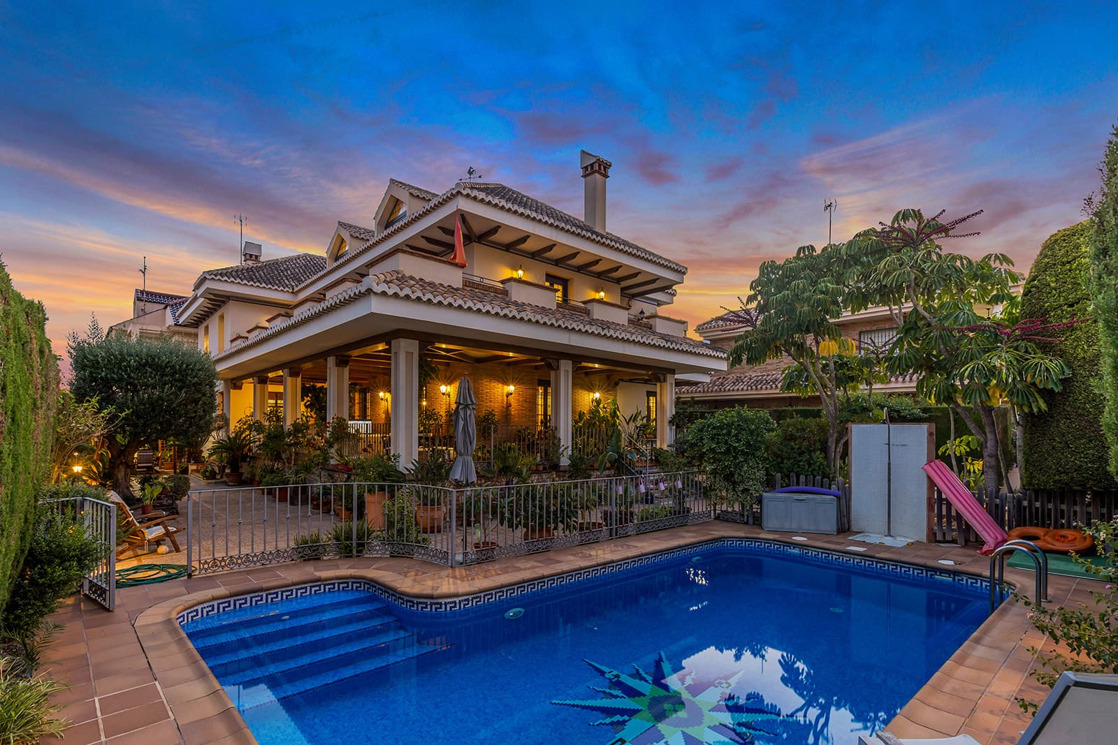 Discover this luxury detached villa for sale in La Veleta, Torrevieja (Costa Blanca South) — one of the most exclusive and sought-after areas for international buyers looking to buy a property near the sea in Spain.Built on a 700 m² plot, this stunning home offers more than 700 m² of constructed area across several levels, combining elegant Mediterranean architecture with the comfort of a modern home. The exterior features traditional tiled roofs, wooden beams, and spacious terraces surrounded by lush greenery.On the main floor, you’ll find a bright living room with fireplace, an elegant dining area, a charming music room, and a fully equipped kitchen finished in natural wood and granite. The interiors are warm and inviting, with handcrafted ceramic floors, ironwork details, and abundant natural light.Upstairs, the villa features large, sunlit bedrooms, including a master suite with private bathroom and terrace. The attic level offers a versatile open space, perfect as an office or leisure area.Outside, the property offers a private swimming pool, covered terraces, a built-in barbecue and wood oven, and a beautifully landscaped Mediterranean garden. The basement includes a spacious garage for multiple vehicles, storage, and a utility room.Located in the prestigious La Veleta residential area, this property enjoys peace, privacy, and proximity to the sea — just a few minutes from Torrevieja’s best beaches, international schools, supermarkets, and restaurants.A perfect opportunity for those seeking to buy a luxury villa in Spain — ideal as a permanent residence, holiday home, or exclusive investment on the Costa Blanca.Keywords: luxury villa for sale in La Veleta, villa for sale in Torrevieja, Costa Blanca property for sale, Spanish villa near the sea, detached villa with private pool, buy villa in Spain.