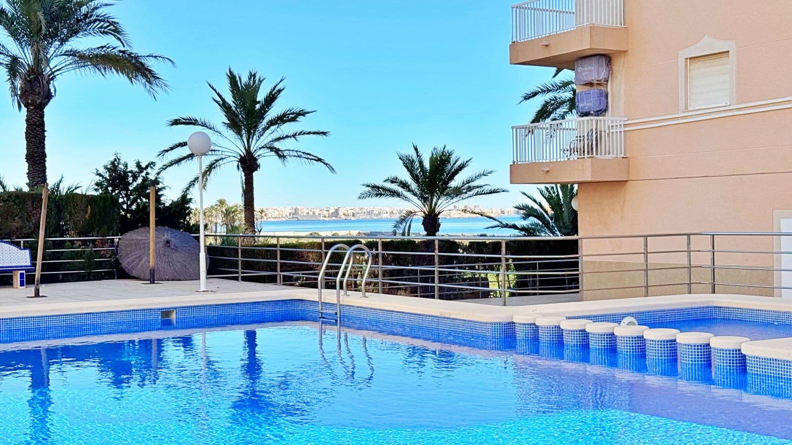 Apartment for sale in Rocío del Mar, Torrevieja, located in an exclusive residential area next to Punta Prima, just 200 metres from the sea. This 43 m² property is part of a private urbanisation with a communal swimming pool, offering a quiet and family-friendly atmosphere all year round.The apartment is in excellent condition and benefits from a south-facing orientation, ensuring natural light throughout the day. It features a bright living-dining room with access to a glazed terrace perfect for enjoying the Mediterranean climate, a fully equipped kitchen, one double bedroom with fitted wardrobe, and a complete bathroom with bathtub and natural ventilation. The terrace has pleasant side sea views and enough space for a table and chairs.Additional features include air conditioning in the living room, awnings on the terrace, tiled floors, lift in the building and adapted access. The property is delivered ready to move into.The private complex offers a large communal pool surrounded by sunbathing areas and well-kept gardens. Its privileged location, only 200 metres from the sea and within walking distance to supermarkets, restaurants, public transport and leisure areas, makes it an ideal option for those seeking comfort and convenience.This apartment in Rocío del Mar, Torrevieja, represents an excellent purchase opportunity — perfect as a permanent residence, holiday home or investment with high rental potential in one of the most desirable coastal areas of the Costa Blanca.