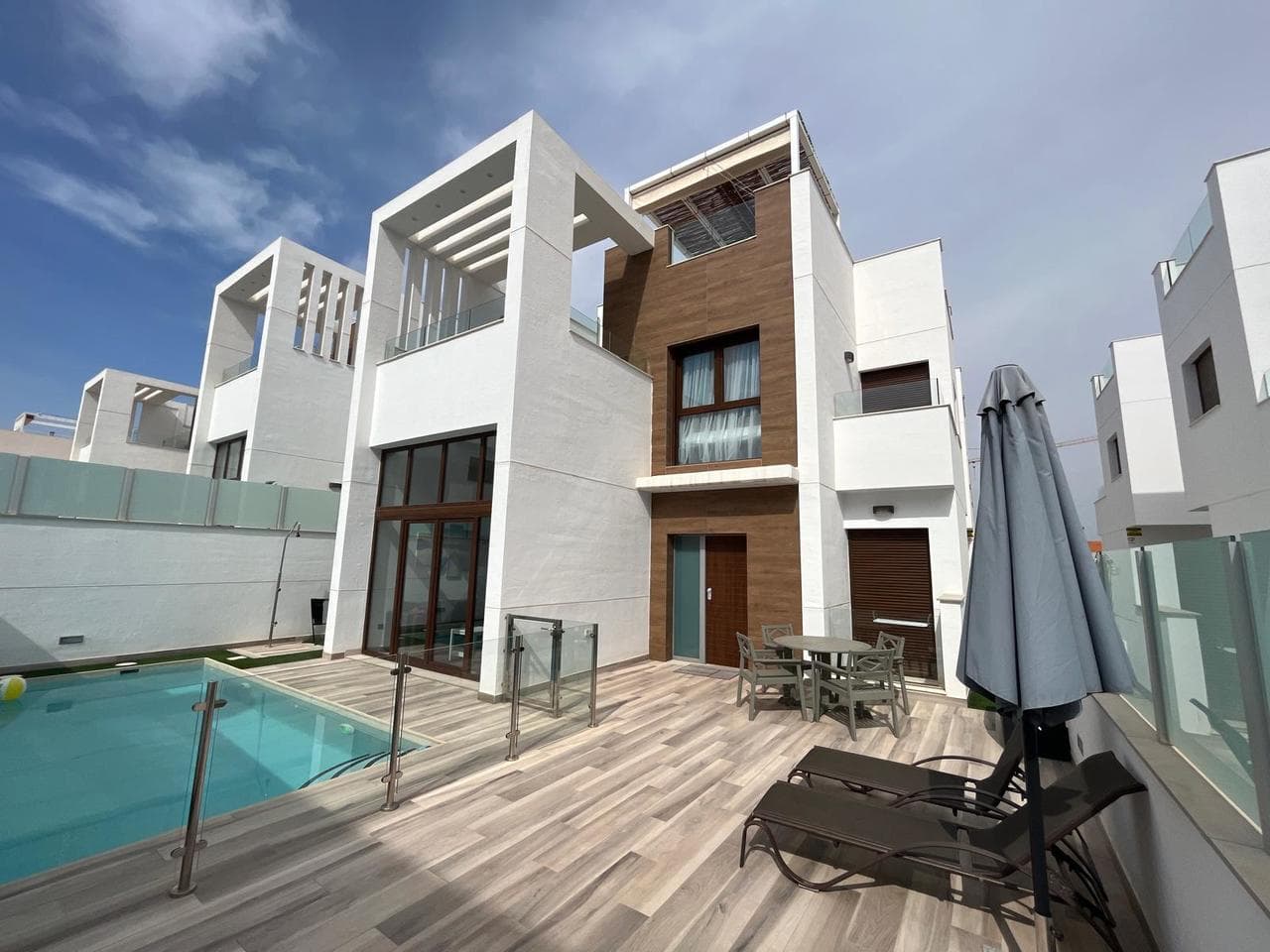 Discover your dream home in this exquisite villa that offers the perfect blend of year-round living and idyllic extended holidays. Boasting breathtaking views of the Pink Lakes of Torrevieja and the sea, this property is nestled in the heart of nature with convenient access to essential services. The community features a generously sized communal pool, while the villa itself comes complete with a private swimming pool, providing the ideal setting for relaxation and entertainment. The living space is bathed in natural light, thanks to large windows that offer a captivating view of the pool. The open-plan kitchen, styled in a modern Scandinavian fashion, seamlessly connects to the lounge, creating a welcoming and contemporary atmosphere. On the ground floor, a spacious bedroom with an ensuite bathroom awaits, along with an additional bathroom for the convenience of guests. The property also provides direct access to the forth bedroom/living room from the inside, currently utilized as living room and cinema area. Venture to the first floor to discover two more generously sized bedrooms and another bathroom. Large terraces and a solarium contribute to the allure of this property, ensuring you can fully savor the vibrant Spanish lifestyle. Inside garage and utility room will come with the property. Situated in the charming area of Orihuela Costa, this home offers proximity to the renowned Pink Lakes of Torrevieja, providing a scenic backdrop for daily living. Torrevieja, a coastal town nearby, further enhances the appeal with its vibrant atmosphere, offering a myriad of amenities, cultural experiences, and pristine beaches. Secure your opportunity to experience the epitome of Mediterranean living - book your viewing now and step into a world of luxury and comfort. The house has a tourist license.