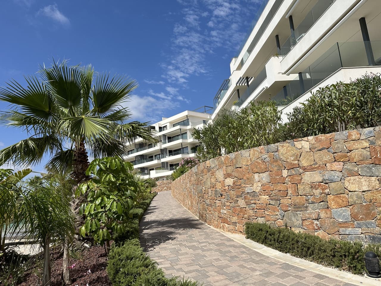 Super modern 2nd floor apartment for sale on sought after Las Colinas Golf resort. This huge apartment has 2 very large bedrooms both with en-suite bathrooms along with a 3rd guest toilet. Their is a fully integrated and slick open-plan kitchen leading into the very wide living and dining room. There is a mega balcony with the most stunning sea views, golf course views and looks down over the manicured gardens and swimming pool. The property is sold as seen, with many extras including underground parking and storage and already has a rental license.