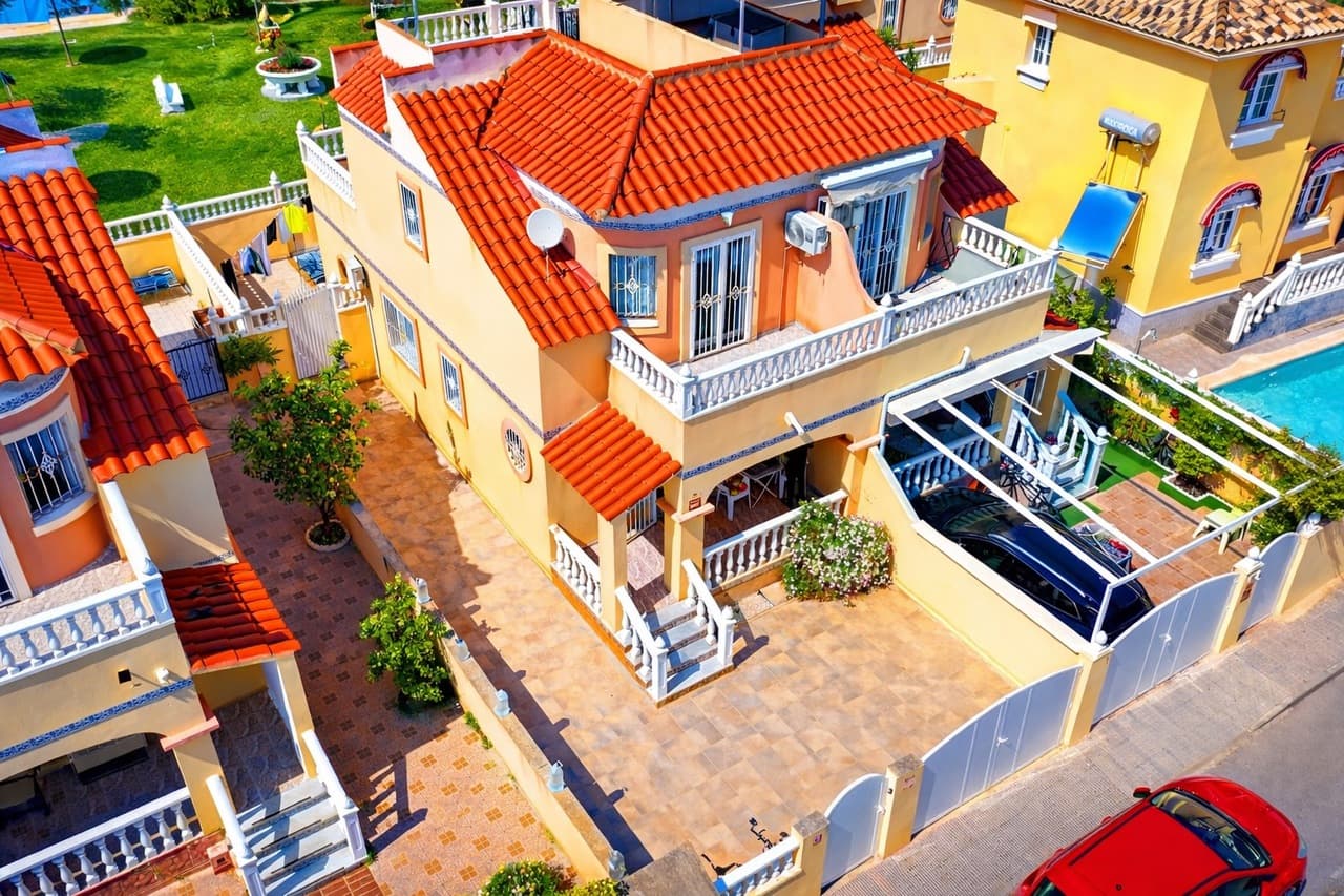 Discover this charming 3-bedroom, 2-bathroom semi-detached townhouse ideally located within walking distance of La Zenia Boulevard, offering the perfect blend of convenience, comfort, and Mediterranean outdoor living.At the front of the property, a sun-drenched private garden provides ample space not only for relaxing but also for secure off-road parking. To the rear, a spacious terrace opens directly onto the beautifully maintained communal pool area, creating a seamless indoor-outdoor lifestyle perfect for entertaining, sunbathing, or enjoying family time.The ground floor features a bright and welcoming living and dining area, a fully equipped kitchen, and a convenient double bedroom, ideal for guests or single-level living.Upstairs, you’ll find two generous bedrooms, each with its own private terrace, offering peaceful spots to enjoy morning coffee or evening sunsets. One of the terraces provides access to a private solarium, delivering additional outdoor space and panoramic views—perfect for soaking up the year-round sunshine. A well-appointed bathroom serves this level.Whether you’re searching for a permanent residence, holiday retreat, or investment property, this home offers an unbeatable location, fantastic outdoor spaces, and direct access to communal amenities—all just moments from shops, restaurants, and beaches.