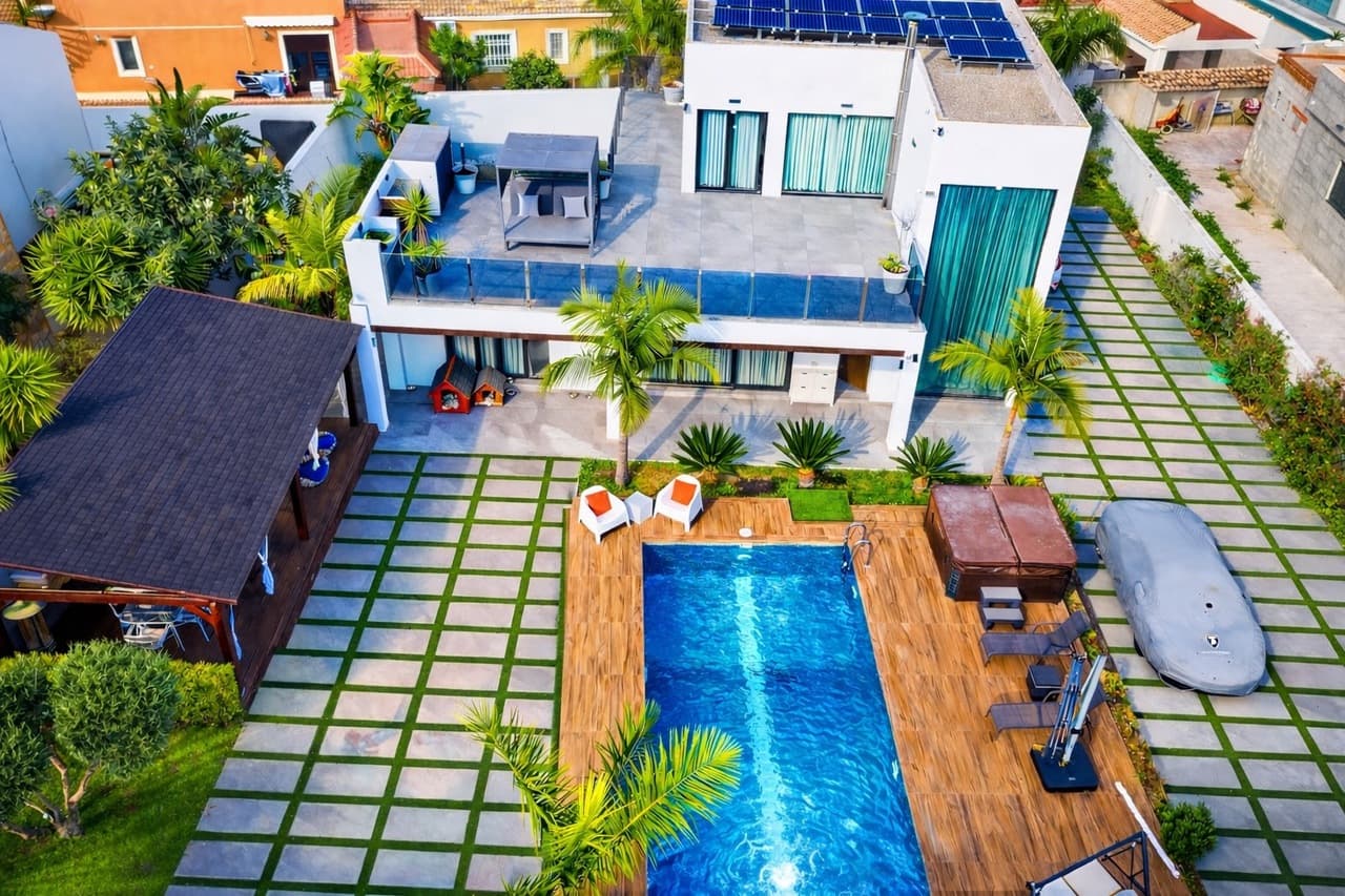 Step into pure luxury with this stunning 3-bedroom, 4-bathroom villa in the prestigious residential area of Los Balcones, set on an impressive 1,000 m² plot and designed to deliver true wow-factor living inside and out.From the moment you arrive, the property makes a statement with a large private driveway accommodating multiple vehicles, beautifully framing the home’s elegant façade and expansive outdoor spaces.As you enter, you’re greeted by a stylish welcome area — the perfect setting to host friends and family for drinks before dinner. This flows seamlessly into a refined dining area and a contemporary open-plan kitchen with island, ideal for social cooking and entertaining. From here, you have direct access to the rear terrace, where lush greenery creates a tranquil backdrop for outdoor dining and relaxation.The first level features a spacious living room, a utility room, and a generously sized bedroom with extensive wardrobe space and its own en-suite bathroom. An additional bathroom on this level ensures convenience for guests and everyday living.Upstairs, a dedicated gaming and leisure area opens onto a large, sun-drenched terrace — a perfect retreat for relaxation or entertaining under the Mediterranean sky. This level also hosts two further bedrooms and two bathrooms, offering comfort and privacy for family and guests alike.The exterior of the property is designed for year-round enjoyment:Private swimming pool for cooling off in styleJacuzzi area for ultimate relaxationCovered seating area providing shade on hot summer daysExpansive grounds offering privacy and spaceThis remarkable villa blends luxury, space, and lifestyle in one of the Costa Blanca’s most desirable locations, close to amenities, golf courses, and the coastline.An extraordinary home for those who expect nothing but the best.