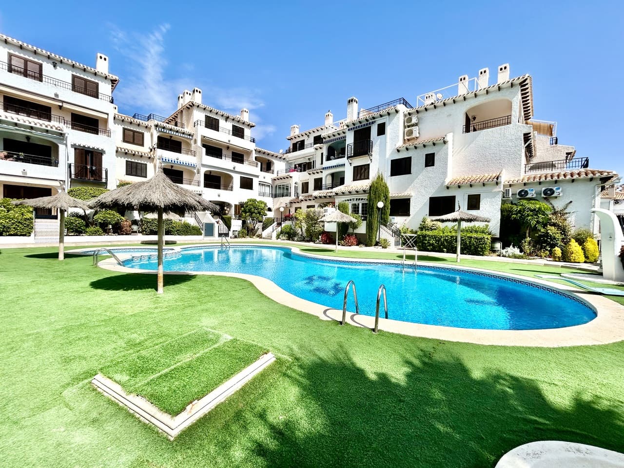 Welcome to this charming apartment in the sought-after Buenavista complex in Cabo Roig, ideally located just a short stroll from the beautiful sandy beaches and the sparkling Mediterranean Sea.This delightful home offers two comfortable bedrooms and a well-appointed bathroom, making it perfect as a holiday getaway, permanent residence, or investment opportunity. From the moment you arrive, you’re greeted by lovely sea views right from the front door—an immediate reminder of its prime coastal location.Inside, the apartment features a bright and inviting layout designed for relaxed living, with plenty of natural light enhancing the warm and welcoming feel throughout. One of the standout features is the large private balcony, offering an ideal space for outdoor dining, entertaining, or simply unwinding while enjoying the Mediterranean climate.Residents of the Buenavista complex benefit from a beautifully maintained communal pool area, surrounded by attractive greenery—perfect for cooling off and soaking up the sun.With beaches, restaurants, cafés, and all essential amenities within easy walking distance, this property combines comfort, location, and lifestyle—an excellent opportunity to enjoy the very best of Cabo Roig living.