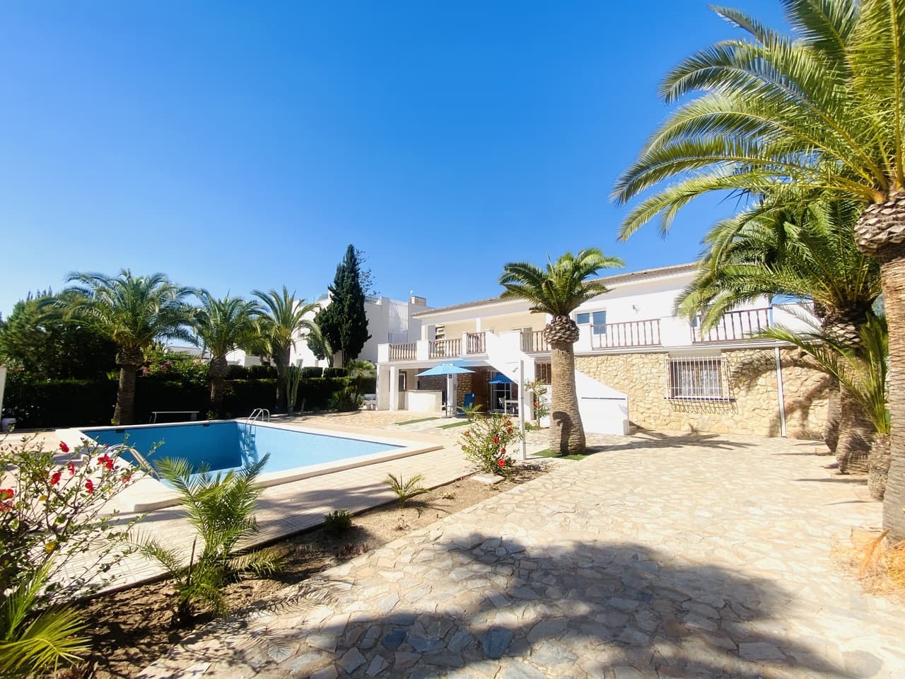 An amazing VILLA in the heart of the warmest part of Europe, 500 meters from the Mediterranean Sea!!!! A great offer in this location !!!On the huge corner plot 1142 sq. m. with a great flowered garden.7 bedroos, 4 bathrooms, 2 spacious living rooms, 2 kitchens, 3 dining areas in house, outdoor kitchen, terraces, 54 sq.m. swimming pool, trastero, garage, garden, solarium.The ground floor is 257.83 sq.m The 1 floor is 128.94 sq.m - can be used as independent flat for 5-6 people.An exquisite house in a romantic Spanish style with added French-Belgian charm. Suitable for a large family. There is a place for children of all ages in the large garden.