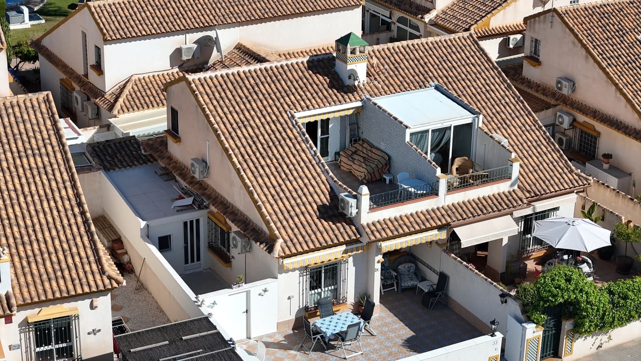 Fantastic opportunity to buy a sunny, south facing bungalow in the heart of La Zenia, just minutes from Zenia Boulevard and just 1,500m to La Zenia Beach. This property has a spacious easy to maintain, tiled front garden with a purpose built shed and storage room. Inside, is a large living and dining room with the kitchen situated to the rear of the house leading onto a spacious utility and storage room with access to the external shed. There are also two large bedrooms along with the family bathroom located on the ground floor. Upstairs leads to the master bedroom with an en-suite bathroom with french doors leading out to the sunny solarium and additional storage room currently used as a fourth bedroom. The property forms part of a sought after complex where home owners can enjoy the immaculate communal pool and communal gardens. Zenia Boulevard shopping mall is just a short 10 minute walk away as well as the Playa Flamenca Saturday market.