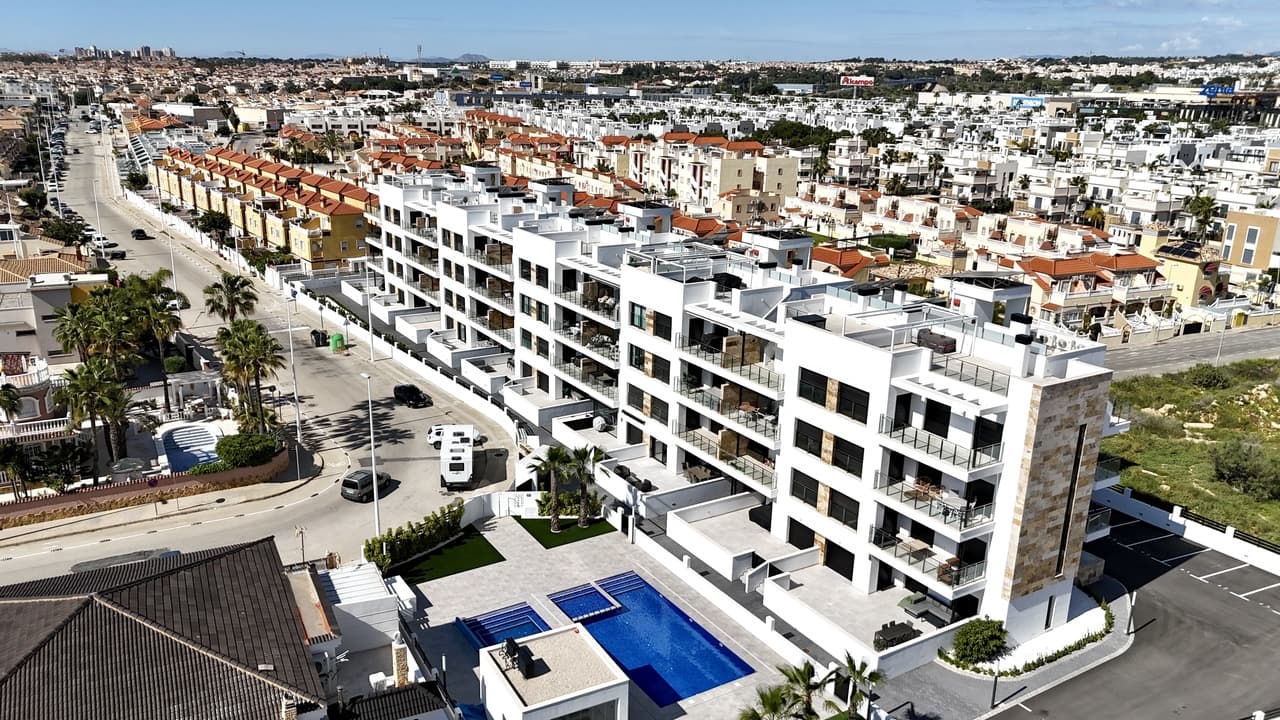 This most impressive two-bedroom, two-bathroom apartment offers the perfect combination of modern design, comfort, and location. South facing and boasting spectacular sea views, the property is set within a quiet and exceptionally well-kept complex that features communal pools with jacuzzi, heated pools for the winter season, and a gym area for residents.Just a two-minute walk from the famous La Zenia Boulevard and only five minutes from the lively Playa Flamenca Saturday market, the apartment is also close to all local amenities, shops, restaurants, and the beach, making it ideal both as a permanent residence and a holiday escape.The interior has been finished to the highest standard, with top-class design, bespoke curtains, built-in wardrobes, and stylish furnishings throughout. The kitchen comes with a filtered water system already installed, and there is a separate utility cupboard housing the boiler and washing machine for added convenience. There are two terraces, one of which enjoys breathtaking sea views, providing the perfect setting for relaxing or entertaining. The property is fully furnished and includes off-road parking in the price. All bedrooms are equipped with storage beds, maximizing space and practicality.This apartment truly offers a rare opportunity to enjoy modern living in one of theThis apartment truly offers a rare opportunity to enjoy modern living in one of the most sought-after locations on the Costa Blanca.