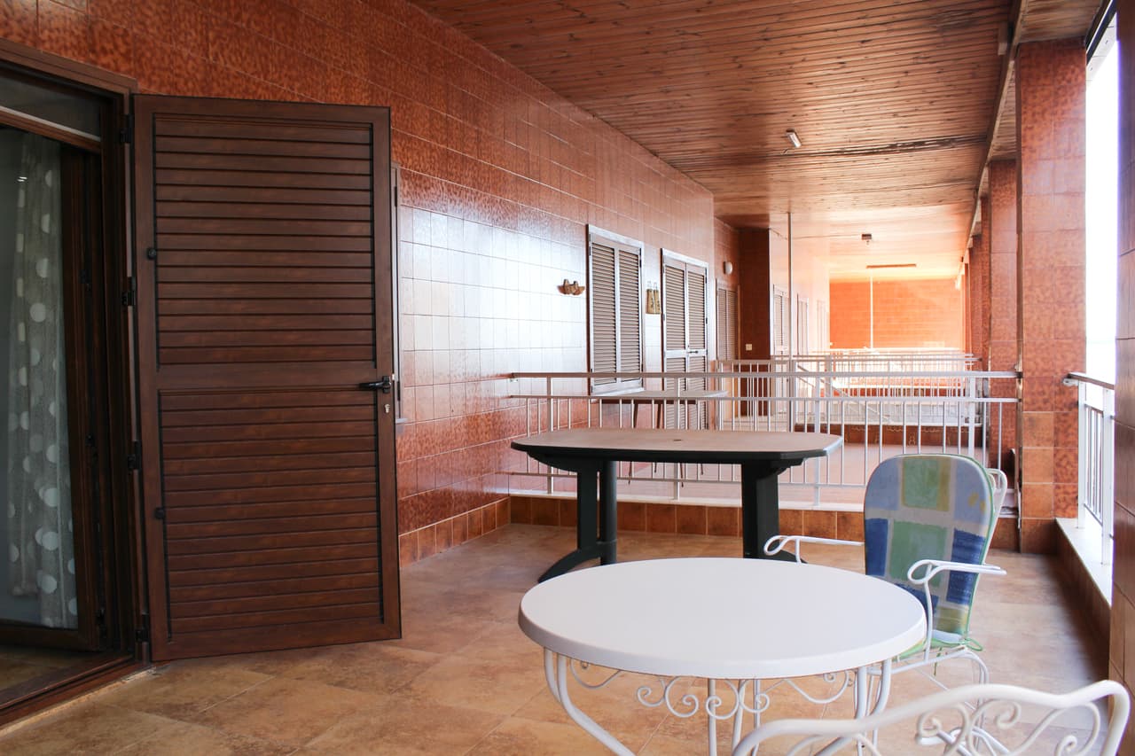 Stunningly beautiful renovated beach apartment available on the beachfront!!! It is a ground floor apartment in El Acequión with an independent entrance to the street and within 20 feet walking distance to the ocean, Communal swimming pool and a Large terrace of 25m2.The property consists of 3 bedrooms (two of them with 2 double beds and built-in wardrobes), 1 large bathroom, 1 toilet, large living room and kitchen. Through the kitchen we have an outdoor courtyard where you can find additional storage and white goods. Everything is renovated with premium quality and design. It installed with brand new central air conditioning. The external enclosures are made of aluminium and Mallorcan. All external doors are fitted with shutter designed mesh mosquito nets, which ca be used if necessary. It has a large community pool with direct access to the beach, shops, supermarkets and several beach bars.