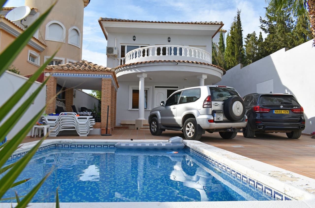 Fantastic spacious villa in green surroundings with proximity to popular golf courses. The location is quiet, private and offers fantastic views of orange groves, the salt lake and the Mediterranean!We reach the property via a pedestrians gate or a wider gate to park the car on the plot. At the front there is a very spacious terrace with pool. We enter the house and arrive in a bright, spacious living room with open plan dining area. Right in front of us we find the separate well-equipped kitchen. On this floor there are also two bedrooms, two bathrooms and laundry room.We go upstairs and find another 3-4 bedrooms and 3 bathrooms. The main bedroom has a jacuzzi, walk-in shower, toilet and balcony with stunning views.Upstairs we find the roof terrace and another room.