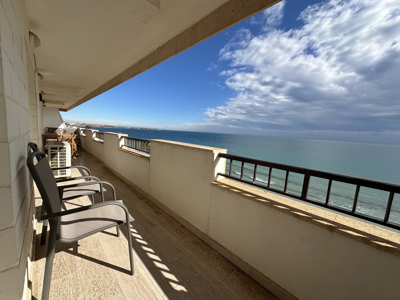FRONTLINE, STUNNING SEA VIEWS! We are proud to present a beautiful, renovated frontline apartment located in Mil Palmeras, renowned as one of the finest beaches on the coast. The apartment is located on the second-floor, features three bedrooms, two bathrooms, and a bright, open living/dining area, and a fully fitted kitchen. The livingroom area opens onto a large terrace, offering beautiful views of the sea. The property comes fully furnished and includes air conditioning and elevator access. It is located within a secure, enclosed community to ensure privacy. Included with the property are two private parking spaces, one in the community garage and one in the outdoor parking area. And it also has a valid tourist rental license. This property is a must see and are hard to find in the area. The area offers a vibrant strip for dining, a lot of restaurants ,bars, beach bars, shops and more. Mil Palmeras is known for its beautiful beaches, clear waters and is considered one of the best in the Orihuela costa coastline.