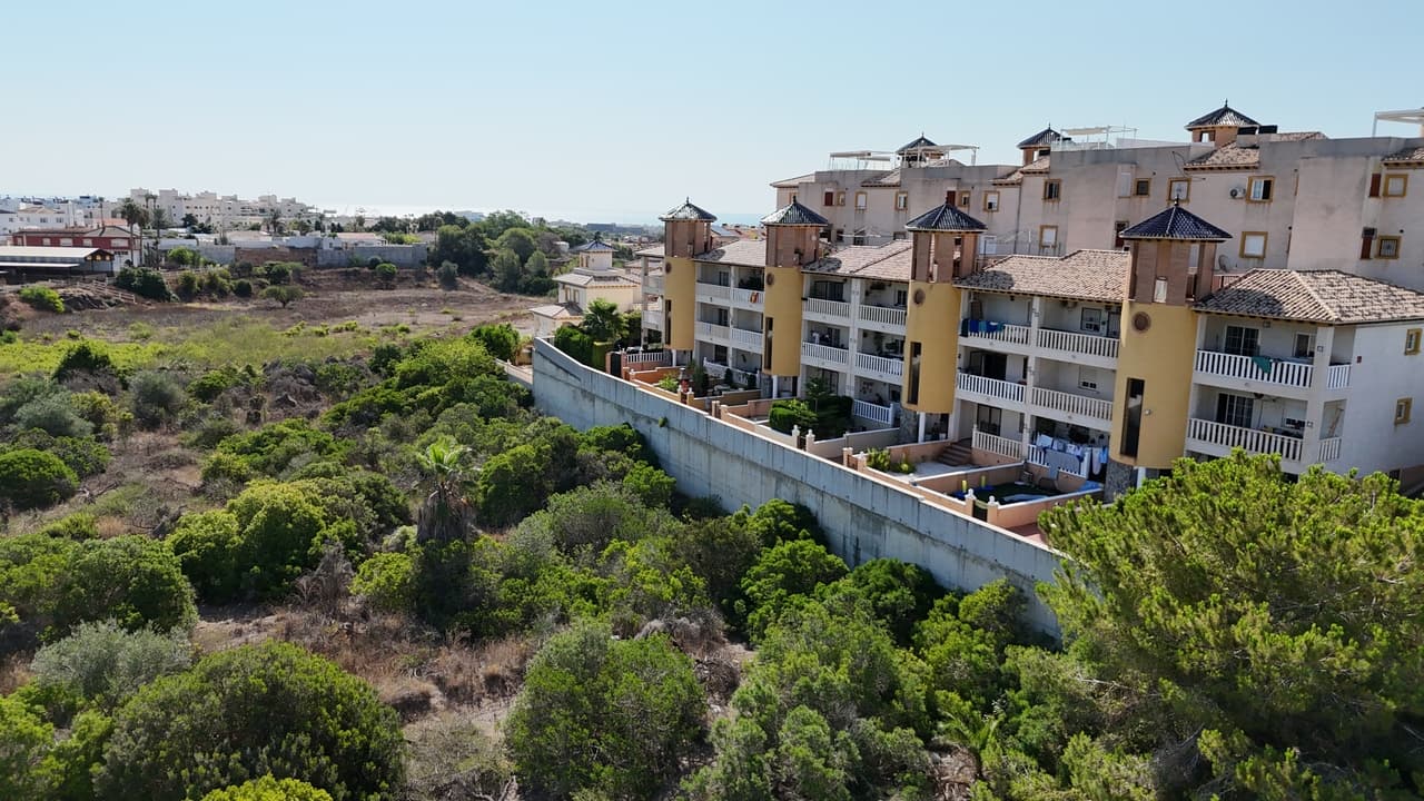 This lovely ground-floor corner apartment, perfectly located in a quiet and maintained urbanisation in Lomas de Cabo Roig. Offering a great blend of comfort, convenience, and value, this property is ideal for families, a holiday home, or an investment opportunity.The apartment features 2 bedrooms, a bright and spacious living area, and access to a communal pool — perfect for relaxing or enjoying time with family and friends. Additional benefits include off-road parking and close proximity to local amenities, restaurants, and beaches.Don’t miss the chance to own this charming home in one of the Costa Blanca’s most sought-after areas!