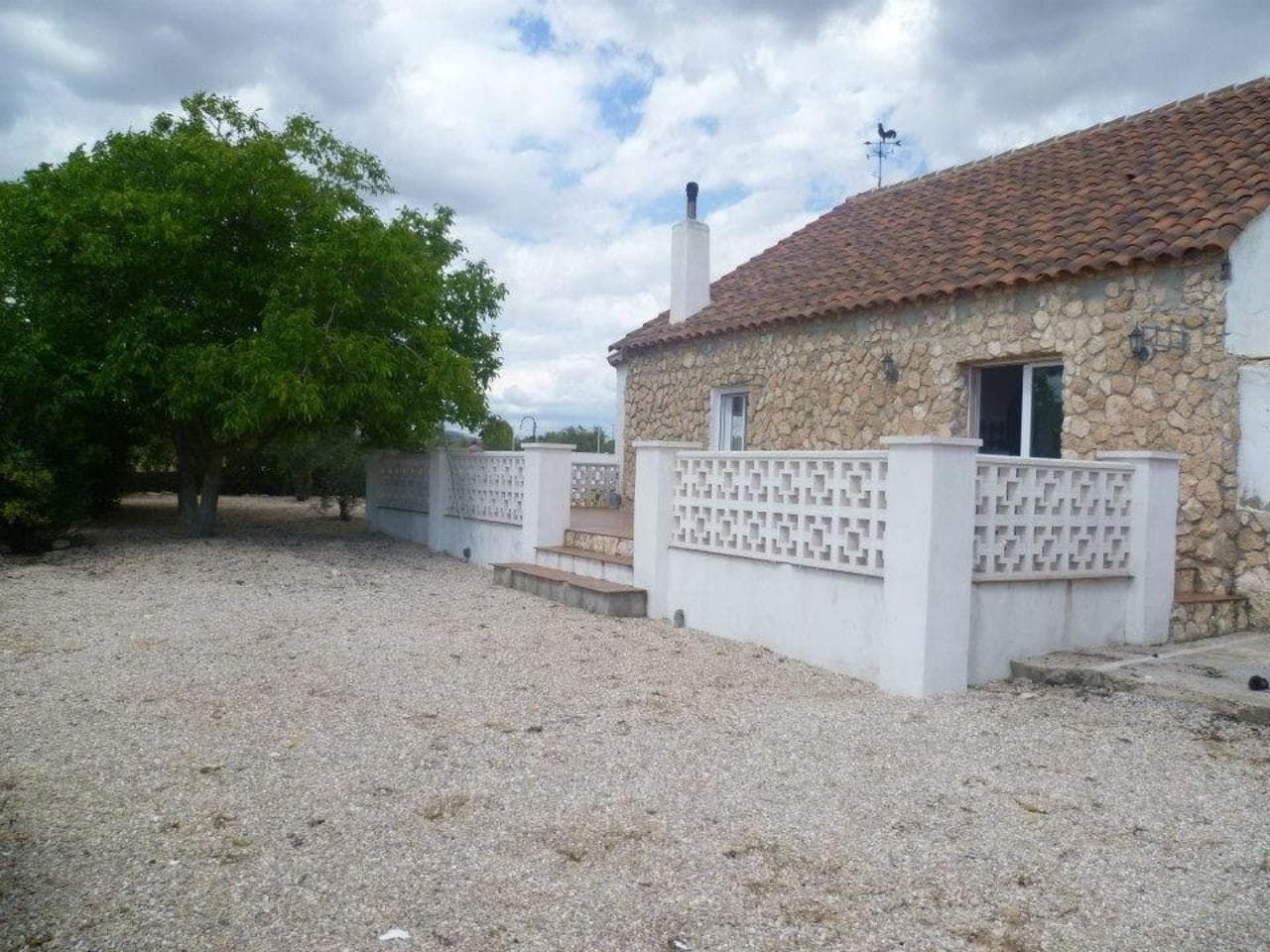 A Beautiful 4 Bedroom Country house Property located only 5 minutes from the large historical town of Yecla. The region is famous for its vineyards and wine BodegasThe property has been extensively refurbished by the present owners and who are still in the process of renovating this Finca to a very high standard. A small amount of TLC will complete this almost finished renovation project.The InteriorThe Interior of the property comprises of 3 double Bedrooms on this level, a large fully fitted modern kitchen with plenty of cupboard space and dining area. The casita which is attached to the main building at the side of the property is currently used as a utility room but can be converted to create a large dining room, which would then be accessed from the kitchen. The Finca has a spacious lounge area with the benefit of a Pellet burner for the extra cosy feeling in the winter months, although the property also has central heating. There is a large fully tiled family bathroom. The fourth double bedroom is accessed via a staircase leading down from the lounge.The ExteriorAccess to the property is via double gates. The main building is completely fenced and has an olive grove behind. There is a 10 x 6m raised swimming pool within its own safe area. There is a chicken hutch, Vegetable garden. All set on a plot of 5500m2 complete with an olive grove, fruit trees and nut trees. There is a double garage with workshop to the side of the property.There are terraces to the front and side with fantastic views to the countryside. The front terrace boasts a new stone fireplace/BBQ. The property is fully double glazed.The Finca is to be sold unfurnished but open to negotiation. Other services include mains water and electricity, satellite dish for sky TV, telephone and WIFI Broadband internet are available.AirportsFlight access to the area is excellent with two main airports in close proximity. Alicante airport and the new Corvera RMU Murcia airport are within 50 minutes drive of most properties in the area. You can find out exactly how far this property is with a simple search.We also have a wide range of professional services that we can offer.Our services include:Extensive Property SearchNegotiationConveyancing ServiceAccountancyNIE applicationOpening of a Bank AccountFinanceTranslatorForeign Currency ExchangeNotaryAfter Sales ServiceTradesmen/Service Providers