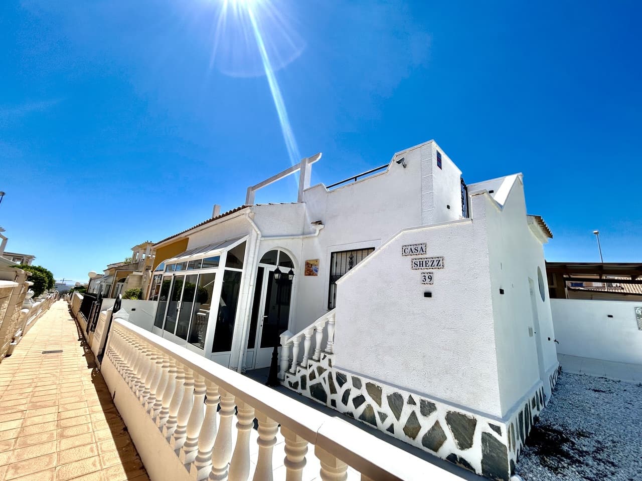 Immaculate and very well presented bungalow style property for sale with sea views. Situated on a corner plot with a fantastic amount of private, outdoor space. Inside, the property offers 2 bedrooms, 1 bathroom, a slick American style kitchen, spacious living and dining areas which lead out to the glazed in terrace. The property has a private roof solarium which is accessed via an external staircase and boasts the sun all day long, here you have wonderful views towards the Mediterranean sea! The property has been tastefully renovated throughout and is sold fully furnished with air-conditioning. The property forms part of the well kept community 'Serena V' which shares a communal pool and bathing areas and is just a few minutes walk from the nearest supermarket, restaurants, bars and convenience stores.