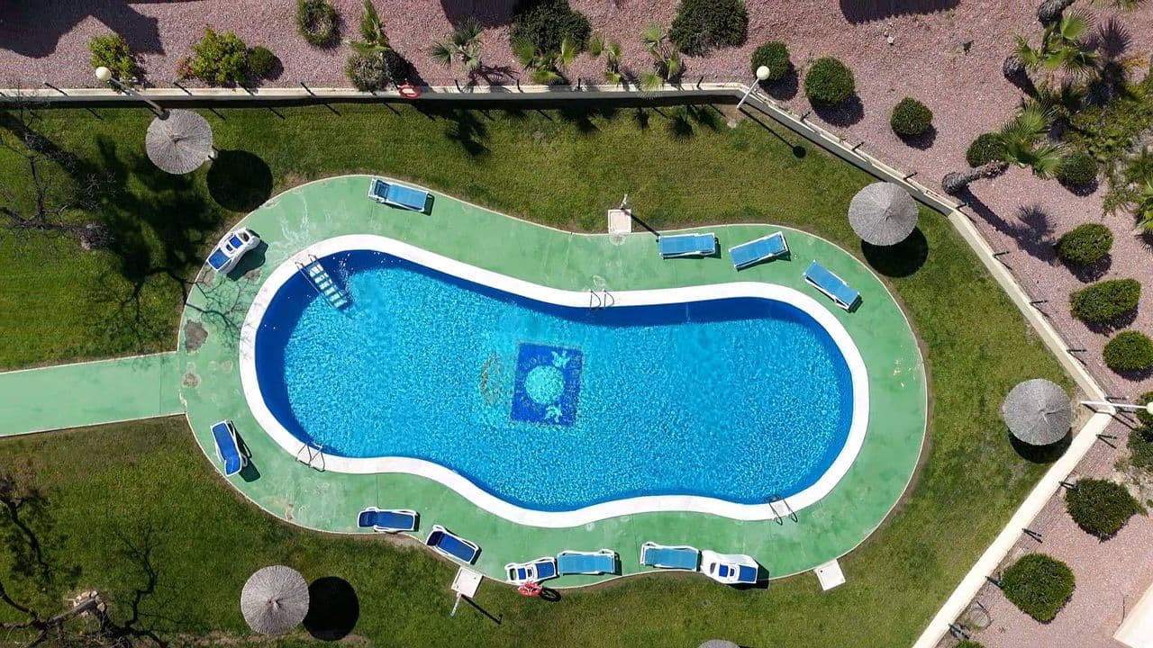 This beautifully fully renovated 2-bedroom, 2-bathroom ground floor apartment is located in the sought-after Campoamor Golf area and offers the perfect blend of modern comfort, outdoor living, and convenience.Facing south, the property enjoys sunshine throughout the day, which can be appreciated from the spacious private terrace, complete with a retractable awning—ideal for relaxing, dining al fresco, or entertaining guests while staying cool in the summer months.The apartment has been renovated to the highest standards, featuring a contemporary design, quality finishes, and a move-in-ready feel that makes it perfect as a permanent residence, holiday home, or rental investment.Residents benefit from access to a well-maintained communal pool and landscaped gardens, creating a peaceful resort-style atmosphere.The location is exceptionally convenient:Walking distance to La Fuente Commercial Centre, with its wide selection of restaurants, cafés, and bars Close to Mercadona and other everyday amenities Just a 10-minute drive to Cabo Roig beach, where you can enjoy golden sands and crystal-clear Mediterranean waters This property offers an unbeatable combination of sunny orientation, modern renovation, outdoor space, and a prime location in one of the most desirable areas of the Costa Blanca.