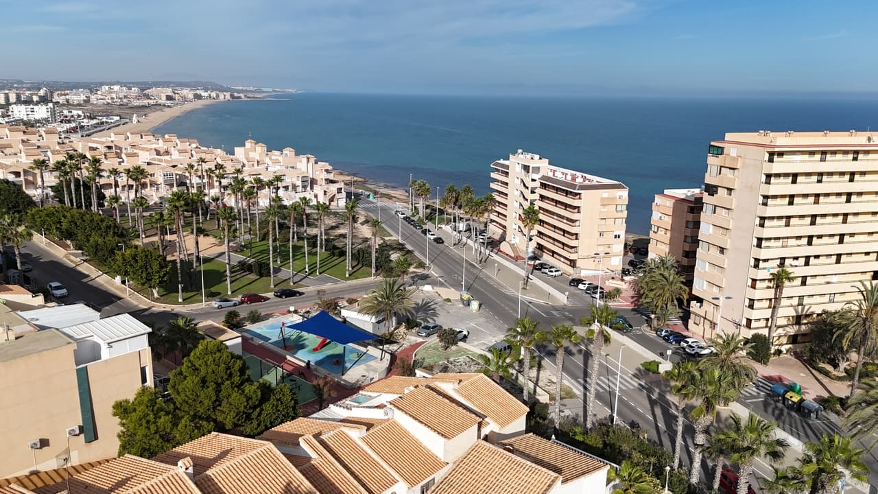 Fantastic opportunity to purchase a bargain property located just 200m from La Mata beach. This duplex apartment forms part of a well established community within easy walking distance to the beach along with numerous restaurants, tapas bars and convenience stores all on your doorstep. The apartment is located just inside the gated community and boasts a private garden along with a private solarium. A staircase leads up to apartment and straight away you have clear sea views out towards the Mediterranean from the living and dining room. There is a American style open plan kitchen along with a double bedroom and the family bathroom. A staircase leads up the second guest bedroom which has private access to the solarium and more sea views. The property is sold as seen with brand new appliances in the kitchen, air-conditioning throughout and a storage room on the ground floor. Residencial 'El Balon de Torreblanca' is a well maintained community where home owners and residents can enjoy the pretty gardens and swimming pool.