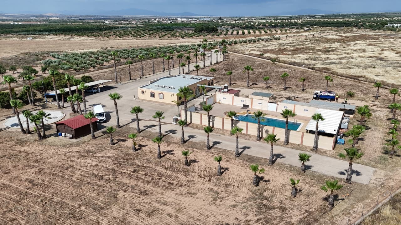 Discover El Oasis, an exceptional finca set within 18.268m² of private land in the beautiful countryside of Fuente Álamo, Murcia, just minutes from the renowned Circuito de Velocidad de Fuente Álamo. Combining spacious accommodation, outstanding leisure facilities, and excellent commercial potential, this is a truly rare opportunity in one of the region's most desirable rural locations.The estate offers approximately 558 m2 of built space and is centred around a stunning 80m² swimming pool, creating a private oasis perfect for enjoying the Mediterranean lifestyle.Designed for flexibility and comfort, the property features two independent residential units, each comprising:3 spacious bedrooms1 bathroomFully equipped kitchenComfortable living and dining areaWith a total of 6 bedrooms and 2 bathrooms, El Oasis is perfectly suited for large families, guest accommodation, holiday rentals, or a boutique hospitality business.A standout feature of the property is its impressive events hall and restaurant, with capacity for up to 150 guests. Whether used for weddings, private celebrations, corporate events, retreats, or a hospitality venture, the venue offers outstanding potential for income generation and business development.Property Highlights18.268² private plotSpectacular 80m² swimming poolTwo self-contained living accommodations6 bedrooms and 2 bathrooms in totalEvents hall and restaurant for up to 150 guestsExtensive outdoor space and parkingPeaceful countryside settingClose to Fuente Álamo Racing CircuitIdeal for residential, tourism, leisure, or commercial useEl Oasis is far more than a finca—it is a unique lifestyle property offering privacy, space, and exceptional business opportunities. Whether you are looking for a prestigious country residence, a thriving events venue, or an investment with multiple income streams, this remarkable estate delivers it all.A truly exceptional property where lifestyle and opportunity meet in the heart of Murcia.