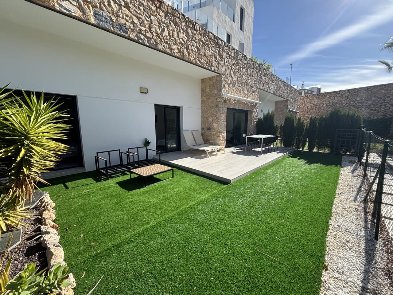 This impressive ground-floor apartment offers bright, contemporary living with a stylish open-plan layout. Large double patio doors open onto a private garden with an electric awning, providing direct access to the immaculately kept communal gardens and swimming pool, which also includes a separate children’s pool. Both spacious double bedrooms have direct access to the garden, while the principal bedroom benefits from its own en-suite bathroom. The apartment features built-in wardrobes in both bedrooms and ducted air conditioning throughout, providing both cooling and heating for year-round comfort. Additional benefits include a private underground parking space, a secure storage room, and an active tourist licence.Located within the sought-after Soleil complex, the property is within easy walking distance of local amenities and Villamartín Plaza. A short drive takes you to the popular La Zenia Boulevard shopping centre, renowned golf courses, and the stunning beaches and marinas of Orihuela Costa. The area also offers a wide range of leisure activities, including cinemas, restaurants, shopping, sports facilities, water parks, bowling, karting, diving, and much more.