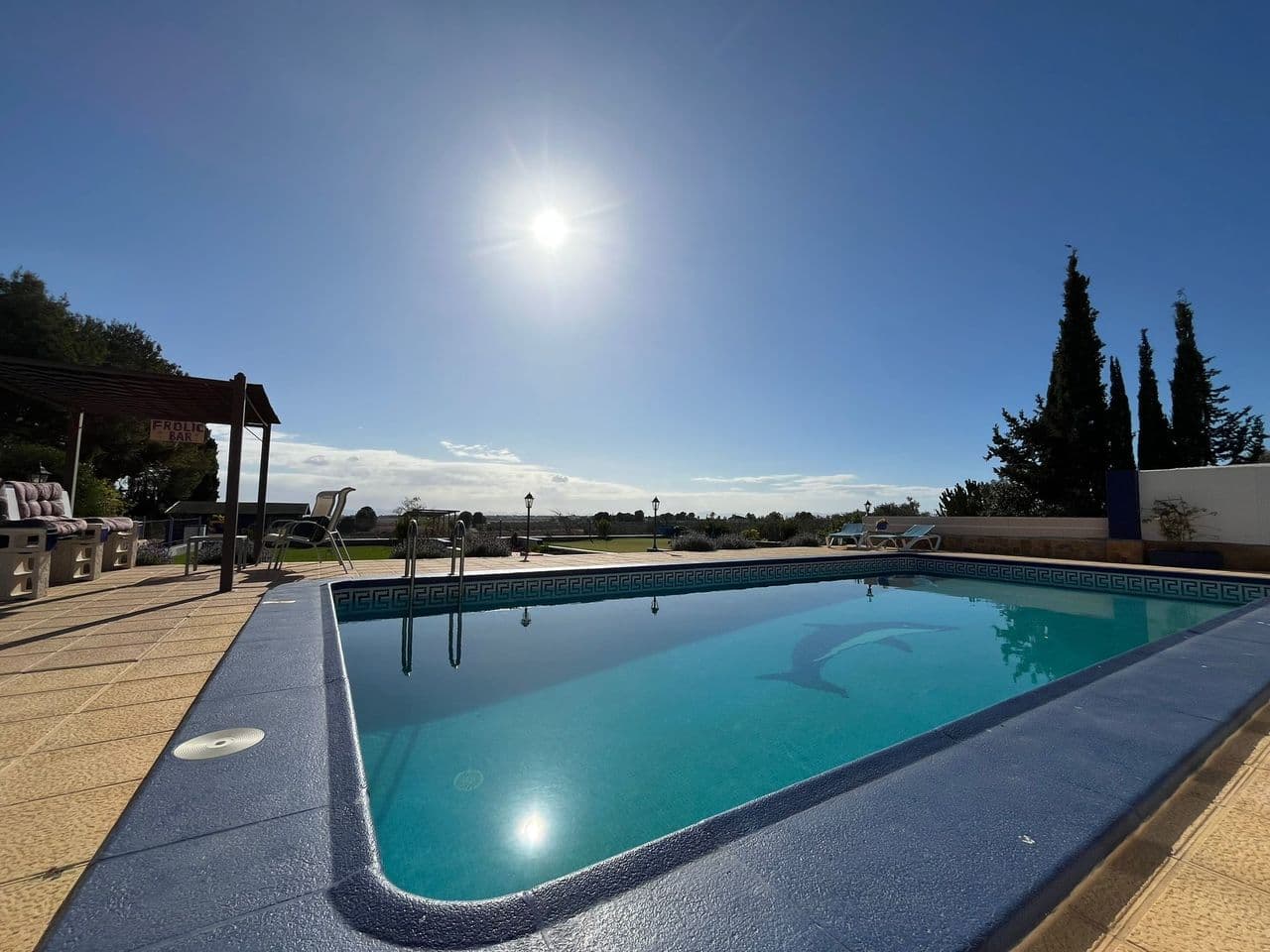 This unique country house, set on an expansive 5,000 m² plot, offers a tranquil retreat with breathtaking views and exceptional amenities. Boasting a generous 368 m² build, the property is perfect for those seeking a spacious home with modern comforts in a peaceful rural setting.The main house features a bright and airy American-style kitchen that seamlessly connects to the living and dining areas, creating the perfect space for entertaining. With four bedrooms and two bathrooms, including a luxurious en-suite in the master bedroom and dressing area, the home is thoughtfully designed to cater to family living. Facing south, the property is bathed in natural light throughout the day, while the cozy wood burner and air conditioning ensure comfort year-round.Outdoor living is at its finest with a 5x10 meter pool, an inviting BBQ area, a covered outdoor kitchen. The property is equipped with solar panels, making it energy-efficient, and also has both gas and electric connections. A storage room provides ample space for tools and equipment.The annex adds even more versatility, offering two additional bedrooms and one bathroom, ideal for guests, extended family, or even as a rental opportunity.Located just a 15-minute drive from Murcia Airport and overlooking La Torre Golf Resort, which is only five minutes away, this property combines the best of country living with convenient access to local amenities. The serene surroundings create a calm and relaxing atmosphere, making it a perfect escape from the hustle and bustle of city life.This exceptional country house is a rare find, offering comfort, space, and tranquility in a prime location. Don't miss the opportunity to make this dream home your own.