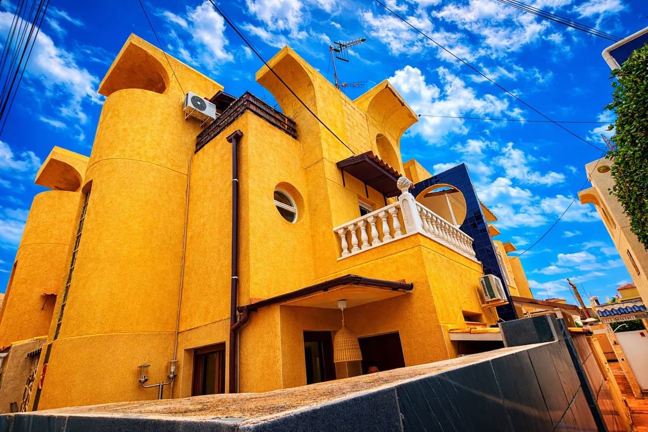 Discover this beautifully renovated townhouse in the heart of Torrevieja, just a 2-minute walk from the sea and close to all amenities — the perfect blend of coastal living and everyday convenience.As you enter, you’re welcomed by a gorgeous living room with a fireplace, creating a warm and inviting space to relax year-round. The adjacent dining area sits just outside the separate, fully equipped kitchen, offering a practical layout ideal for both daily living and entertaining. On this level, you’ll also find a utility room with the potential to be converted into a downstairs toilet, adding extra functionality and value.Upstairs, the property features two generously sized bedrooms and a modern family bathroom. The master bedroom enjoys its own private balcony, perfect for morning coffee or evening relaxation.The top floor has been thoughtfully converted into a third bedroom, providing flexible space for guests, a home office, or a hobby room.Residents can also enjoy access to a communal pool, while the beach, shops, restaurants, and local amenities are all just moments away.This turnkey home is ideal as a holiday retreat, permanent residence, or investment opportunity in one of the Costa Blanca’s most sought-after coastal areas.