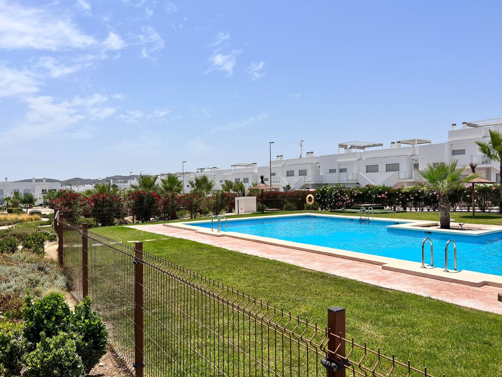 This beautifully maintained first floor apartment offers 55 m² of bright, open living space in excellent condition. It has 1 spacious bedroom with fitted wardrobe and 1 modern bathroom. The property also has a fully equipped open kitchen, air conditioning and is fully furnished, the linnen and all kitchen utensils stay and is therefore ready to move in.

 Enjoy outdoor living with two private terraces – one north facing and one south facing – perfect for sun or shade at any time of day. There is also a solarium and access to a well-maintained communal garden and swimming pool . Additional features include a reinforced door, a laundry room and attractive finishes.

 This is the ideal holiday home, ideal rental investment or a peaceful year round home. It is just a 2 minute walk to local amenities, bars and restaurants, 5 minutes to Vistabella Golf, 15 minutes to the beach and 45 minutes to the airport.