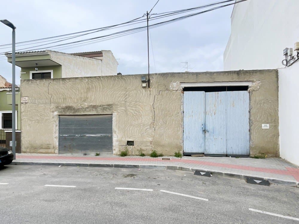 wp:paragraph Don't miss this gem! We present an unparalleled opportunity to build your dream home in a prime location. This 221 m² urban plot is located in the vibrant center of Dolores, offering comfortable living with all the amenities at a price rarely seen.Unbeatable Location and Perfect ConnectionsTown Life: You'll be just steps away from a wide variety of shops, bars, and restaurants, enjoying authentic Mediterranean living.Market at Your Doorstep: Every Friday, the popular town market is located just 650 meters away on foot, perfect for buying fresh produce and local crafts.Beaches and Airport: Enjoy the coast with the beautiful beaches of La Marina just a 20-minute drive away. For your travels, Alicante Airport is a convenient 30-minute drive.A Blank Canvas for Your Personal ProjectCurrently, the plot houses a 92 m² warehouse that can serve as temporary storage. However, its true value lies in its potential:Build to Your Taste: Once the sale is finalized, the warehouse will be demolished, freeing up the entire 221 m² for you to design and build a beautiful home entirely to your specifications**, without any pre-existing limitations.Smart Investment: Plots with this central location and at this price are rare. Secure a solid investment in the heart of the Vega Baja region.This is an opportunity that won't come around again anytime soon!Don't hesitate any longer; your dream home starts here.Contact us today and don't miss this exclusive opportunity. /wp:paragraph