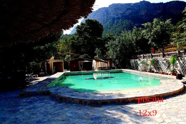 Welcome to Blissful Living in MurciaEmbrace the charm of countryside living in this splendid country house nestled in the vibrant Costa Blanca Sur area of Murcia. Set on an expansive plot of 21,843 m², this property is designed to provide a serene retreat away from the hustle and bustle of city life, inviting you to experience the beauty of nature at its finest.Spacious InteriorsThis delightful residence boasts a generous built area of 284 m², offering ample space for relaxation and entertainment. With three well-appointed bedrooms and two bathrooms, the layout is perfect for families or those seeking room to host friends. The thoughtfully designed interiors are filled with natural light, creating a warm and inviting atmosphere that feels like home from the moment you walk in. Do need some refurbishment.Outdoor OasisThe outdoor space is perhaps the crown jewel of this property. A private pool offers the ideal spot for refreshing dips on warm Mediterranean days, while the surrounding garden provides a lush, tranquil environment ideal for leisurely strolls or vibrant gatherings with friends and family. The property features both an open terrace and a covered terrace, perfect for enjoying alfresco dining or soaking in the breathtaking views of the surrounding landscape.Functional and FurnishedThis country house comes furnished, ensuring you can easily settle in and start living your dream lifestyle immediately. The inclusion of a summer kitchen and barbecue area makes it an entertainer’s haven, perfect for hosting summer barbecues or cozy family dinners under the stars. Parking is also available, making accessibility a breeze.Future Energy EfficiencyAs an added bonus, the property is in the process of obtaining energy certifications, showcasing its potential for becoming an environmentally friendly home. This commitment to sustainability aligns well with the lifestyle offered in Costa Blanca, where nature thrives and outdoor living is celebrated.A Slice of Heaven AwaitsDon’t miss your opportunity to own this idyllic country house in Costa Blanca Sur, where the fusion of comfort, nature, and elegant living creates a unique atmosphere for all who enter. Whether you seek a permanent residence or a holiday getaway, this home promises to be your personal haven.