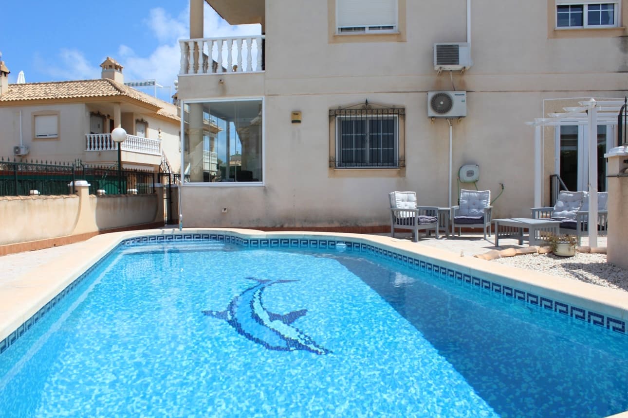 This beautifully 2 bedroom ground floor apartment with private garden and swimming pool is located in Sol Golf I - Pau 8, Villamartin. Just a short walk to the famous Villamartin Plaza and golf course. The apartment features a spacious 143m2 tiled garden with a private 10x5m swimming pool, BBQ and a covered terrace with glass curtains, offering an ideal space for year-round outdoor living. Inside, the property offers a bright and inviting lounge with feature fireplace, leading through to a modernised kitchen with separate utility room and shower room, along with direct access to the garden and an electric blind for added comfort. A small hallway leads to two double bedrooms, both with fitted wardrobes, and a contemporary family bathroom with walk-in shower. Additional features include air conditioning, high-speed fibre optic internet (FTTH) – ideal for remote working – and is being sold furnished, including white goods. Sol Golf I enjoys a prime location at the entrance of Pau 8 with a communal swimming pool, public transport is easily accessible, with a bus stop and taxi rank nearby and within 10 min walking distance to all amenities, supermarkets and to the popular Villamartin Plaza with lots of restaurants and bars, bank only a 10 min drive to the beautiful sandy beaches of Orihuela Costa, and 5 min to La Zenia Boulevard the largest Shopping centre in the Alicante province with over 150 shops plus restaurants and bars. For golf enthusiasts there are 4 local Golf Courses; Villamartin, Las Ramblas, Campoamor and Las Colinas. Alicante airport and Corvera airport in Murcia are about 45 minutes drive away.