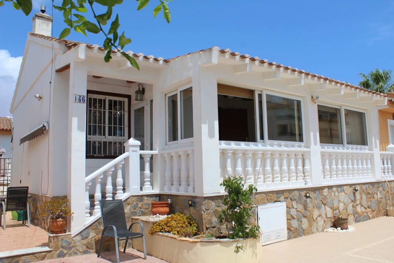 This well-maintained s/w facing detached Villa located in the popular, tranquil Urbanisation Horizonte / Playa Flamenca area in Orihuela Costa, offers a harmonious blend of comfort and Mediterranean charm. The property consists of 2 bedrooms, 2 bathrooms, the master bedroom benefits from an on-suite bathroom with shower room and the 2nd separate bathroom with bath tub. A very spacious living room including a cosy wood burner with a semi-independent fully equipped kitchen, creates an inviting space for relaxation and entertaining. Enjoy dining on the expansive, bright and airy glass enclosed terrace, or unwind on the private roof terrace, a perfect spot to bask in the sun. The lovely outdoor area consists of a 260 m2 wrap round low maintenance tiled garden, offering an outdoor shower and plenty of space for relaxing or the construction of your very own swimming pool! This welcoming house comes fully furnished and includes a storage area on the roof terrace, private off-road parking, radiators in the living room and air conditioning for year-round comfort. Situated in a peaceful, prime location, but only within 10 min walking distance to the popular Scandinavian commercial centre of "Horizonte" or commercial "La Mosca" in Playa Flamenca both with a variety of local amenities, Bars Restaurants, sport facilities and supermarkets. The property is close to 4 renowned golf courses ( Villamartin, Campoamor, Las Ramblas, Las Colinas ) and the sandy beaches of Orihuela Costa embodying the relaxed Costa Blanca lifestyle. Not to forget the close by “Zenia Boulevard” with 150 shops a paradise for shopping lovers.This attractive home presents an excellent opportunity for both full-time living and holiday retreats due to his perfect location, only 45 min drive from Alicante and Murcia / Corvera airport. Don't miss out on experiencing the best of Mediterranean living—schedule a viewing today. Price is negotiable!