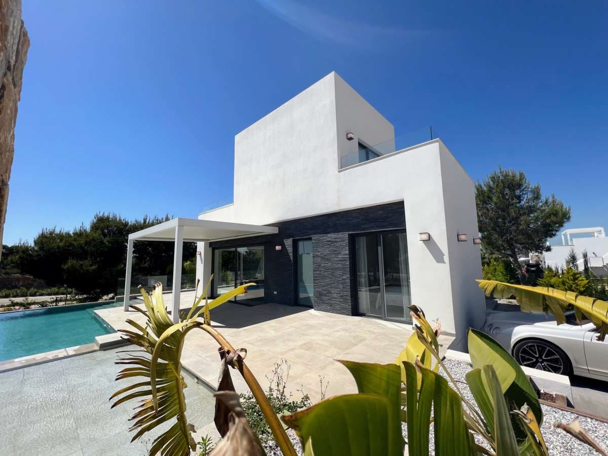 Recently built beautiful villa located in Las Colinas that is fully furnished and move-in ready. Has a rental licence.

Upon entering the property you immediately enter the living area and spacious open plan kitchen once you have passed the stairs to the first floor and a guest bathroom. On the ground floor, there is one bedroom with a spacious bathroom. From the living room and lounge, you have direct access through the large sliding windows to the terrace and the beautiful swimming pool. The terrace is also fitted with a large pergola equipped with an electrically operated slat system which you can set at any angle to block out the sun, if needed. The large infinity pool is built in an L-shape with an extra shallow platform to properly enjoy the sunny days.On the first floor we find 2 bedrooms and a bathroom. Both bedrooms have access on the terraces.