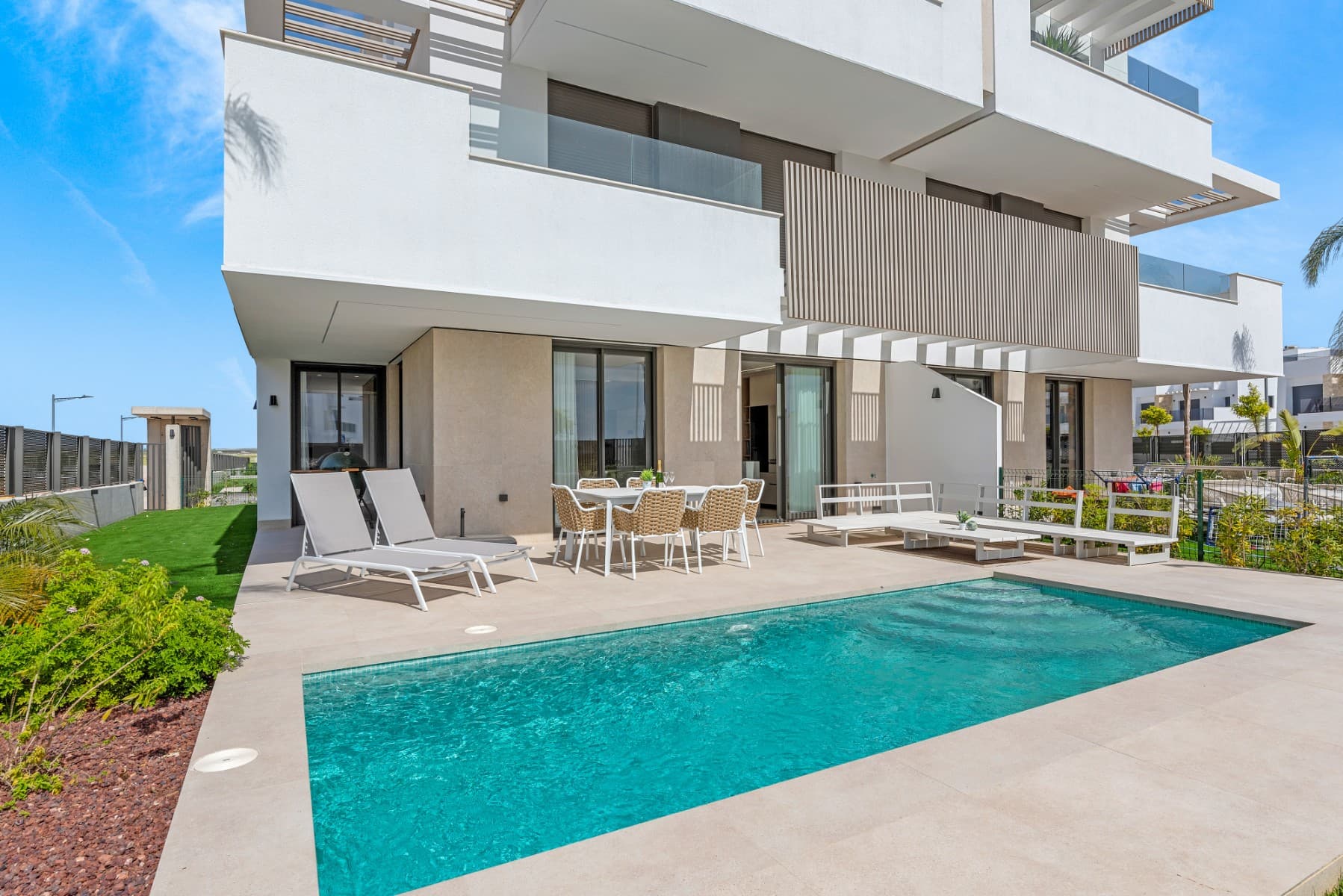 Are you looking for a unique property where comfort, luxury, and a true holiday atmosphere come together seamlessly? Then this exclusive ground-floor apartment is exactly what you’ve been searching for. This brand-new, never-before-inhabited residence is part of a prestigious and carefully designed development centered around a stunning turquoise lagoon – a rare and idyllic setting seldom found in Spain.

This is a unique opportunity to own a turnkey, contemporary home in one of the most sought-after locations on the Costa Blanca. The layout has been thoughtfully designed to offer maximum comfort: three spacious bedrooms, two fully equipped bathrooms, a bright and open living area with a modern kitchen, and a large private terrace with your very own swimming pool. Everything is created to offer the ultimate living experience, perfectly blending indoor and outdoor life.

Finished to the highest standards, the apartment features attention to detail and durable, low-maintenance materials, such as artificial grass on the terrace. The kitchen comes fully fitted with modern appliances, and the integrated air conditioning system ensures a pleasant indoor climate throughout the year. With its ground-floor location and direct access to the garden and pool area, you can enjoy your own private paradise any time of day.

The location is simply unbeatable. The enchanting lagoon is just a short walk away, offering opportunities to swim, sunbathe, or relax in a truly serene setting. A variety of sports and leisure facilities are also nearby, making this property not only perfect for personal use but also highly appealing as a rental investment. Beautiful beaches, renowned golf courses, and vibrant coastal towns are all just a short drive away.

Whether you're looking for a second home, a solid investment, or a permanent residence under the sun, this apartment truly offers it all. Be enchanted by this unique living experience in an exclusive and harmonious setting – a place where every day feels like a holiday.