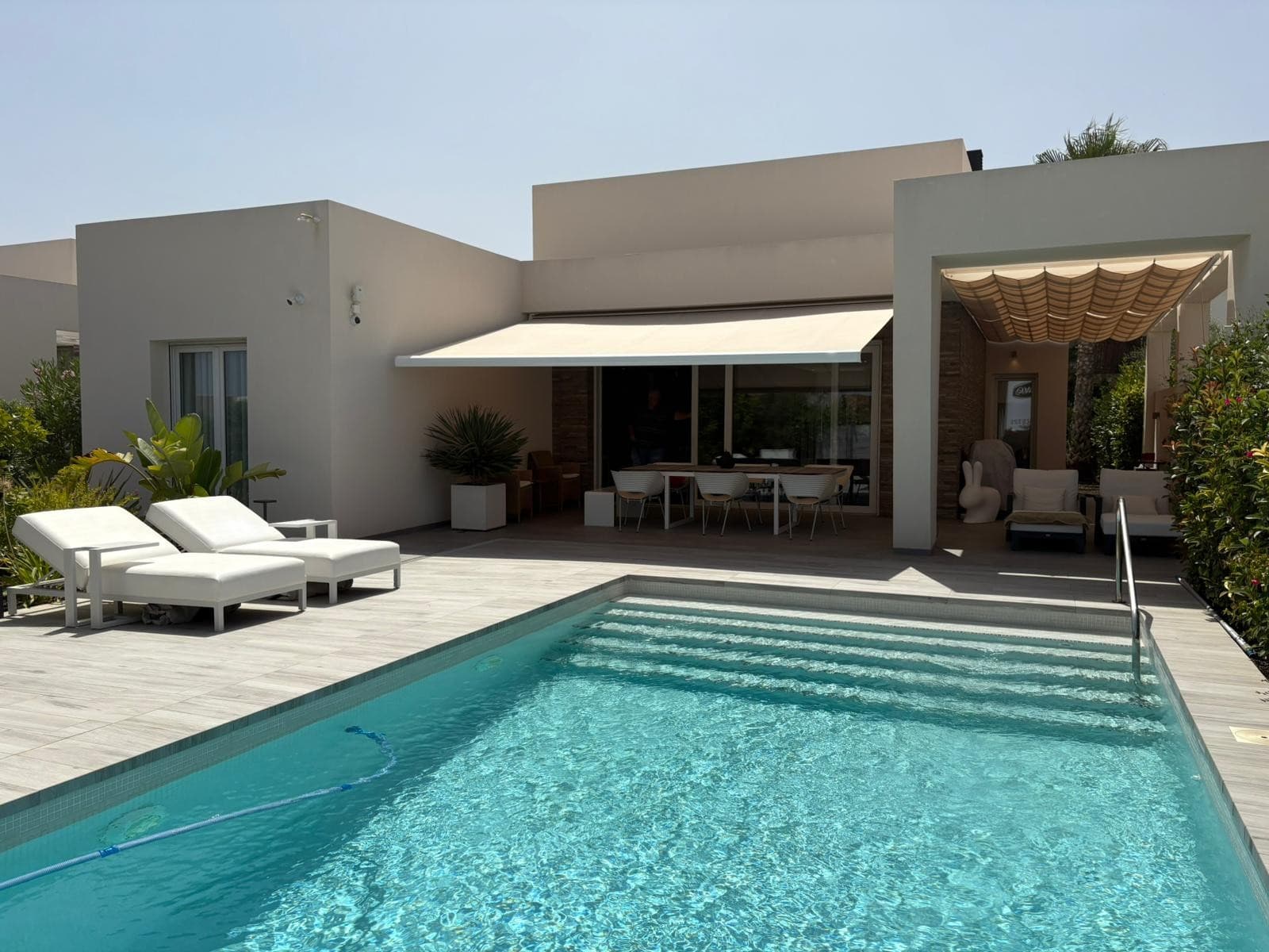 This move-in-ready villa is set on a 500 m² plot within the prestigious La Finca Golf Resort in Algorfa — one of the most sought-after golf destinations on the Costa Blanca. With its elegant design, premium finishes, and prime location, this property offers a unique living experience under the Spanish sun.

Stylish Living with Premium Features

The villa offers 2 spacious bedrooms, 2 sleek bathrooms with underfloor heating, a guest toilet, and an open-plan living area filled with natural light. A third room is currently used as a dressing room or office but can easily be converted into an extra bedroom.

The modern kitchen is fully equipped with high-end appliances from brands like Miele and Liebherr — a clear mark of quality.

Outdoor Comfort & Privacy

Enjoy Mediterranean living in the beautifully landscaped garden with palm trees, flowers, and fruit trees. The east-facing terrace with a built-in BBQ is ideal for relaxed outdoor dining, while the private pool with wide entry steps offers the perfect spot to unwind. Residents also have access to a shared pool within the community.

Additional Features Include:



 Smart home system (lighting,   blinds, and more)

 Electric   shutters

 Air   conditioning & alarm system

 Charging   point for electric vehicles

 Satellite   TV and sun awning



Prime Location – La Finca Golf

Set within a well-maintained resort with a championship 18-hole golf course, luxury hotel, spa, fitness center, and tennis/padel courts. Just 15 minutes from the sandy beaches of Guardamar and 35 minutes from Alicante Airport.

Note: Furniture is not included but may be purchased separately.

Don’t miss the opportunity to own this one-of-a-kind villa in a prime Costa Blanca location. Contact us today to schedule a viewing!
