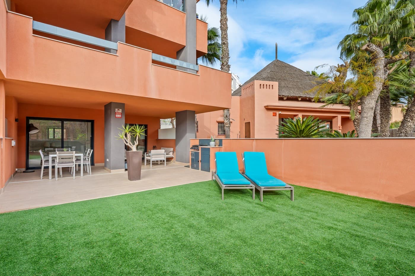 Located in a quiet and charming urbanisation in Orihuela Costa, this well maintained ground floor apartment offers a generous private garden of 61 m² and combines comfort, outdoor space and a pleasant location, making it suitable both as a holiday home and for permanent living.The property features two bedrooms and two bathrooms and offers a practical layout with an open living area and kitchen, creating a bright and comfortable atmosphere. The living room provides direct access to the terrace and garden, ensuring a smooth transition between indoor and outdoor living.The garden enjoys pleasant sunshine in the morning and early afternoon and offers a lovely space to relax, have breakfast or enjoy the Mediterranean lifestyle without excessive late afternoon heat.The apartment is sold fully furnished and is ready to move into. In addition, there is a separate storage room with washing machine and a private parking space, which further enhances everyday comfort.Within the urbanisation there is a well maintained communal swimming pool with sun loungers and parasols, ideal for relaxing on warm days, while the residence itself is known for its peaceful and pleasant atmosphere.All daily amenities such as supermarkets, restaurants, shops and beaches are located nearby, making this location both practical and attractive.This apartment is an excellent choice as a second home, rental investment or comfortable permanent residence and offers a well balanced combination of tranquillity, space and accessibility.