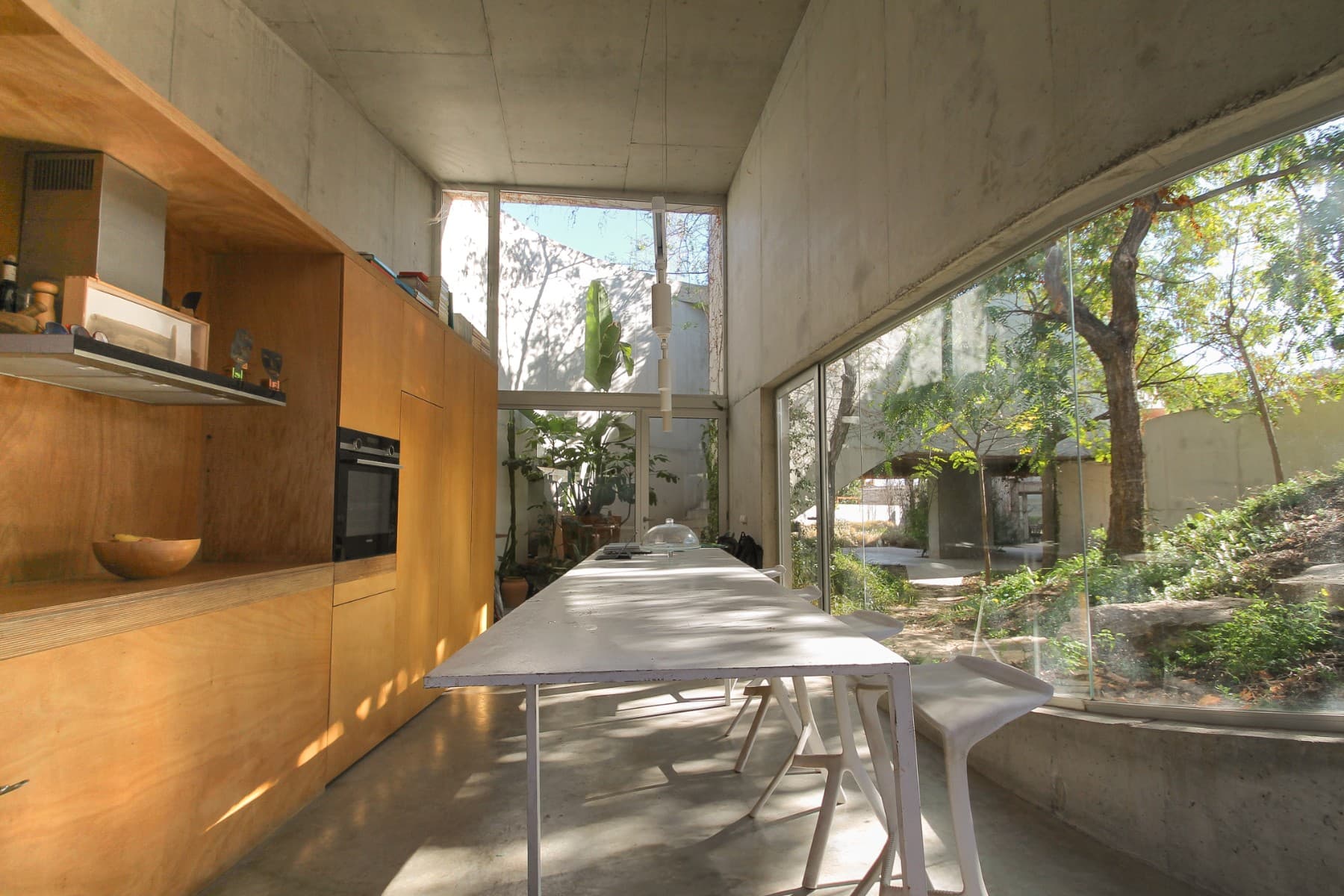 Unique Home for Sale: Live the Design, Feel the Nature.The design of this home is defined by the uniqueness of its plot, making it an alternative to the ubiquitous cloned residential model along our coastline. More than a conventional building, this house proposes a new way of living, maximizing the benefits of Alicante's Mediterranean climate, where the average annual temperature hovers around 19°C.The architecture organically adapts to the boundaries of the plot, shaping its form through walls that delineate the space and create a fluid connection between the interior and exterior. Through a series of courtyards, the distribution of spaces is naturally organized, transforming the house into a habitable garden. The raw concrete walls, awaiting the embrace of vegetation, enhance this fusion between architecture and nature.The house is structured in three independent modules, offering versatility and multiple usage possibilities. In the first module, a studio with a mezzanine provides the option to become an independent loft-style dwelling, as it has its own bathroom facilities and an elevated space ideal as a bedroom. In the central module, a barbecue area and an outdoor dining space are integrated under a concrete structure, open to the garden, creating a perfect setting for outdoor leisure. Finally, in the third module is the main house, which features a kitchen, a spacious living room, and two bedrooms with en-suite bathrooms.The exterior is a true natural retreat with multiple areas for enjoyment: a pool surrounded by vegetation, an outdoor lounge for relaxation, and several areas with strategically placed chairs to enjoy the surroundings. This house offers endless possibilities for further development according to your needs, achieving the perfect balance between life in nature and proximity to urban areas.Moreover, its design allows for easy expansion or customization according to the future owner's tastes and needs, making this property not just a home but a long-term investment opportunity. Ideal for those seeking a tranquil and private lifestyle, yet still close to all services and urban life in the area.