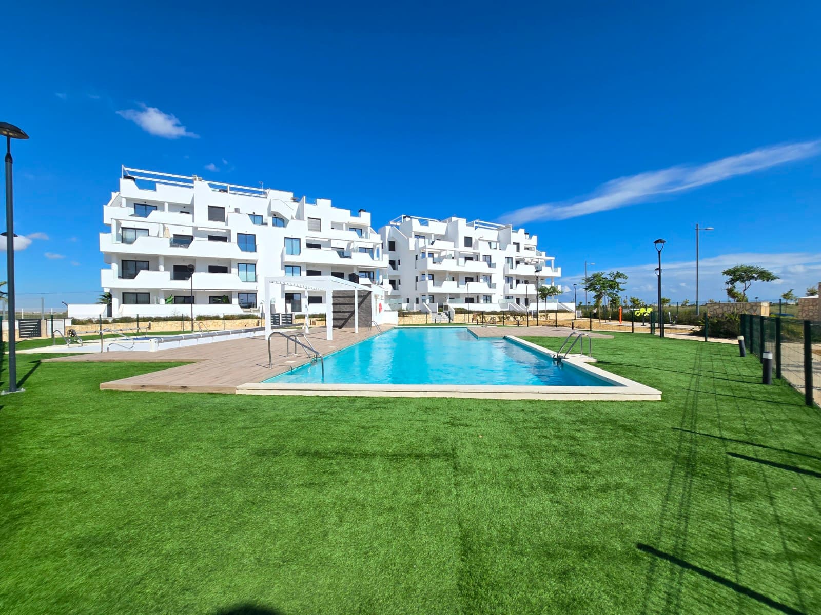 Discover this recently built, ready-to-move-in apartment in the exclusive Santa Rosalia Lake & Life Resort, one of the most unique and luxurious residential resorts on the Costa Cálida. This stylish apartment combines modern comfort with high-quality finishes and offers a peaceful, resort-style lifestyle just minutes from the coast.



Layout & Comfort

The apartment has 2 spacious bedrooms and 2 fully equipped bathrooms, perfect for families or guests. The bright and open-plan living and dining area seamlessly connects to a private terrace, ideal for enjoying the Mediterranean sun or a relaxed al fresco dinner.



Facilities

Residents have access to two communal swimming pools, one of which is heated for optimal comfort all year round. There is also a small outdoor gym, children's playground and a communal jacuzzi for ultimate relaxation.



Extras

The apartment comes with an underground parking space and a private storage room, offering extra convenience.



Santa Rosalia Lake & Life Resort

Built around an impressive artificial lake with crystal clear water, this prestigious resort offers numerous recreational facilities such as sports fields, a mini golf course, a fully equipped gym, and a modern clubhouse with restaurant and bar. The resort guarantees an active, social and relaxed lifestyle in a safe and beautifully maintained environment.



Perfect as a permanent home, holiday home or investment.



Suma: To be allocated.

Community fees: 2640 euro/year
