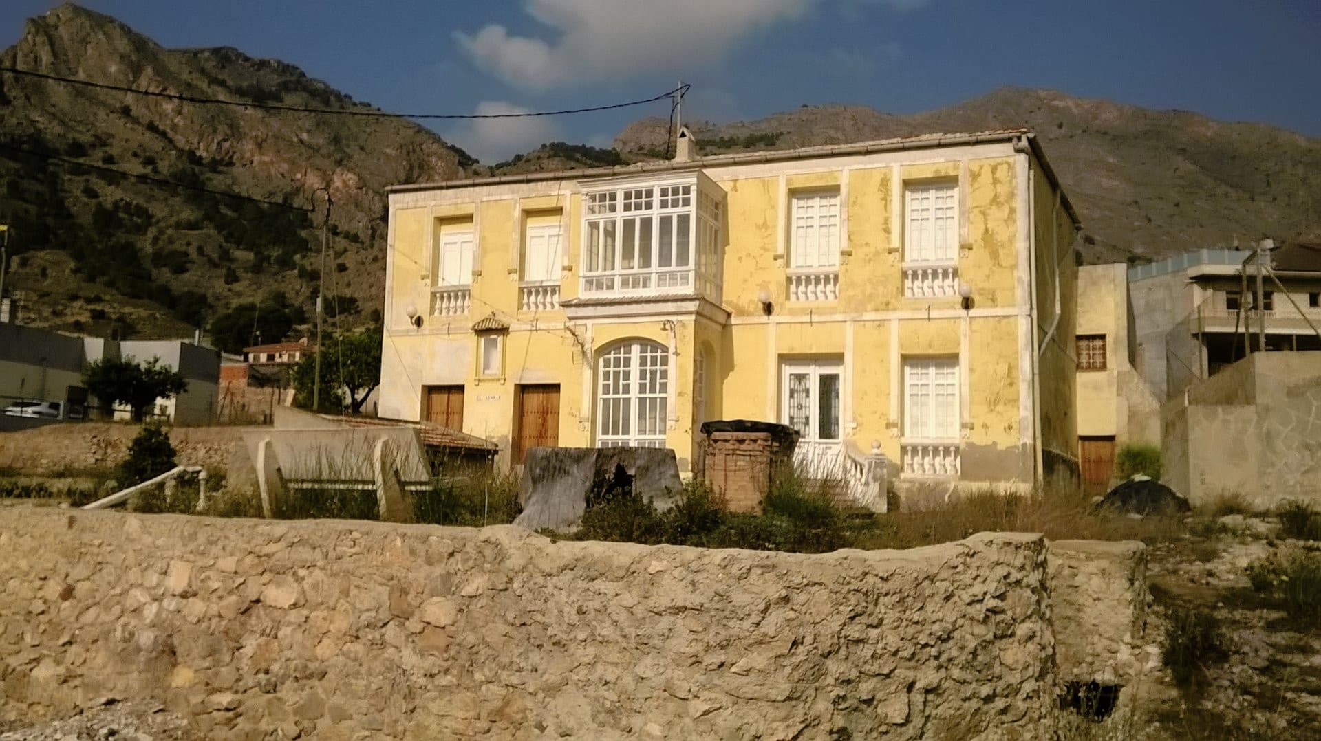 FANTASTIC OPPORTUNITY! 12,441 m2 FINCA for sale in Raiguero de Bonanza, Orihuela, Alicante, located 2 km from the city.Location in the foothills of the Sierra de Orihuela, a non-flood area, with beautiful views of the Vega del Segura and the surrounding mountains. The property includes: - 3,488 m2 of residential urban land in the core of the district, buildable on two floors plus basement and loft, with 100% occupation of the land for the construction of semi-detached homes, and 40% for the construction of detached homes. Orientation of building plots is East. 30 semi-detached houses can be built, each on a plot of 6 meters in front and about 18 meters deep. - 1,133 m2 of urban land destined for roads. - 7,451 m2 of rustic land, which borders the urban area of ​​the district and has paving and sewage services in streets, drinking water, electricity, and telephone. In the consultative document of the project of the new General Urban Planning Plan of Orihuela, a “proposal for expanding the urban land” in Rincón de Bonanza is reflected, which affects this rustic land of the property. - 369 m2 of urban residential land, located as an enclave in the rustic land, occupied by a beautiful house of 431 m2 built. This house has seven bedrooms, two living rooms, two verandas, a kitchen, a bathroom, a patio, a warehouse and a hermitage. - Infrastructure (well, 2 ponds, etc.). Right to use 10,000 m3/year of water from the well for irrigation of the entire property.The property is entirely surrounded by semi-detached houses and individual chalets, built on both urban and rural land. Raiguero de Bonanza is a district of Orihuela with a population of about 1,400 inhabitants, but with all the necessary services, such as supermarkets, schools, hairdressers, banks, cafes, church, pharmacy, medical center, urban transport, etc. The farm is located at a distance of just 2 km from the city of Orihuela, 20 km from Murcia Capital, 30 km from the beaches of Orihuela Costa, Torrevieja and Guardamar, and 60 km from the Alicante international airport, from the that there are regular flights to all of Europe. This FINCA is a possible investment for:- Promoters and builders.- Rural hotel- Celebration room.- Camping.- Etc.