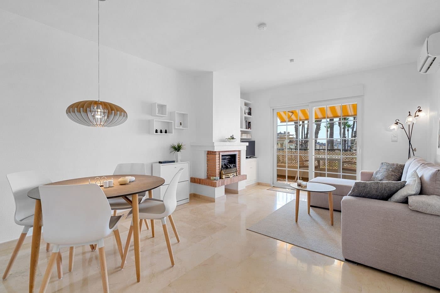 Welcome to this bright and well-maintained apartment in charming Spanish style – located in a sought-after area of Playa Flamenca, with everything you need within walking distance.The apartment offers two good-sized bedrooms with built-in wardrobes and air conditioning, as well as a neat and functional bathroom. The kitchen is bright and welcoming, with access to a practical utility patio where you’ll find the washing machine and ample storage space.The living room is spacious and filled with natural light – with access to a lovely southeast-facing terrace, ideal for a café table and enjoying the view of the beautifully maintained communal area with palm trees and a pool. The awning provides pleasant shade on hot summer days.From the terrace, a staircase leads up to the true gem of this apartment – the large private roof terrace! Upthere you can enjoy the sun from morning to evening while taking in the breathtaking views of the palm-lined pool area and the sea on the horizon. The roof terrace is equipped with a pergola for shade, a large storage room, and an outdoor shower – perfect for relaxing, sunbathing, and cozy evenings under the open sky.Built in 1998, the property is in excellent condition.It is sold fully furnished with all white goods included and is move-in ready.There is air conditioning in both bedrooms and in the living room – all units with both heating and cooling functions. Additionally, a gas fireplace and electric radiators provide comfort during the cooler months.An added bonus is the installed water filtration system, allowing you to drink directly from the tap.The apartment is also a non-smoking home.The area is peaceful and well-maintained – with a communal swimming pool including a children’s pool and green areas, creating a relaxed holiday atmosphere all year round.Communal parking is available within the complex, with convenient access close to the apartment.The location is hard to find better:You’re just 450 meters from Lidl Supermarket, with plenty of cafés, bars, and restaurants nearby.The popular beaches of Playa Flamenca (1.6 km) and La Zenia (3 km) are only a few minutes’ drive away.The large Zenia Boulevard shopping center (1.4 km) is reachable in under 5 minutes.Several renowned golf courses are within a 10–15 minute drive.You’ll also find mini golf and a padel court nearby, so you can enjoy an active holiday without needing to go far.Alicante Airport is about 45 minutes away – easily accessible via the AP7 motorway or N332 coastal road.This is a home filled with sunshine, charm, and functionality – perfect as a holiday retreat, permanent residence, or investment property.Move-in ready – contact us today to schedule a viewing!