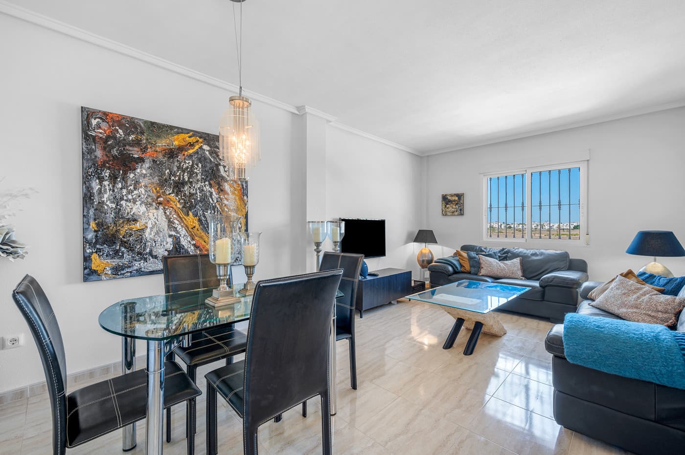 This spacious and well-kept penthouse apartment is located on the first floor with its own private entrance in the sought-after residential complex Brisas y Golf III.It offers plenty of space and excellent outdoor areas – including a large private roof terrace with open views of the surrounding area.The layout is well thought out, with the living areas grouped together and the sleeping area tucked away at one end of the home.The three bedrooms are practically arranged off a hallway, and the master bedroom has its own en-suite bathroom.The kitchen is open to the living and dining room, creating a bright and functional space with room for both a sofa area and dining table.From the kitchen, you have access to a covered utility patio, ideal for storage and housing the washing machine.Outside the front door, there&039;s a charming west-facing terrace with space for outdoor dining, enjoyable all year round.A staircase from the terrace leads up to the large private roof terrace – perfect for barbecues, lounge furniture and relaxing under the open sky.Built in 2006, the apartment is in good condition and features classic Spanish charm.It is sold furnished and comes with air conditioning in both the living room and the master bedroom.A private, numbered parking space is included and located inside the gated community.There is also convenient street parking directly outside the property.As a resident, you also have access to two communal pools surrounded by greenery and palm trees.Both pool areas were renovated in spring 2025.Outdoor exercise equipment is also available in the complex – perfect for staying active without needing to go to a gym.The location in El Barranco, near Los Dolses, makes this property particularly attractive for those looking to be close to both everyday conveniences and holiday experiences.Restaurants and cafés are within walking distance, and the local Dialprix supermarket is just one kilometre away.A short drive takes you to the beautiful beaches of Orihuela Costa, the popular Zenia Boulevard shopping centre, several top-rated golf courses including Villamartin and Campoamor, as well as nearby padel and mini golf facilities.In short, this is a fully equipped and move-in-ready apartment with a great location, private parking, and generous outdoor living – ideal for holidays or year-round living.