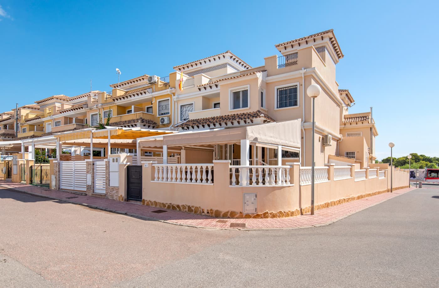 This charming and well-designed townhouse is located in the popular area of Aguas Nuevas in the northern part of Torrevieja – close to the city, shopping, the Friday market, and, not least, the beach.The property is an end-unit on three levels, offering private outdoor spaces and plenty of room for both family holidays and year-round living.Built in 2005 and the home is in excellent condition. The layout is functional and offers a great balance between shared living areas and private bedrooms.Layout and Features;On the ground floor, you&039;re welcomed by a large, sunny terrace with a pergola and roll-down side awnings, ideal for shade or privacy as needed.There’s ample space here for both outdoor dining and lounge furniture.The entrance leads through a covered, partially glazed terrace, which can be fully opened during the warmer months.Inside, you’ll find a spacious living room with air conditioning and a separate kitchen, which was fitted with brand-new appliances in May 2025.Behind the kitchen is a bright extension currently used as a dining room, with direct access to the rear patio that also houses the washing machine and provides additional storage space.There’s also a bathroom with a shower on this level.The first floor offers three well-sized bedrooms and a second bathroom with a shower. All bedrooms feature built-in storage and air conditioning.On the top floor, you&039;ll find a lovely private roof terrace with views over the surrounding area and a glimpse of the Mediterranean Sea – a perfect spot to enjoy your morning coffee or relax at sunset.Outdoor areas and the communial area;Thanks to its corner plot, the townhouse benefits from extra outdoor space. In addition to the main terrace, there’s a practical lockable storage shed – perfect for garden furniture, bicycles, and beach gear.The community features a beautiful swimming pool surrounded by green lawns and palm trees – ideal for relaxing on sunny days.There’s also communal parking right in front of the property, accessible only to residents of the complex.Location;Aguas Nuevas is known for its peaceful atmosphere and excellent access to everyday amenities.You’ll find grocery stores, cafés, and restaurants within walking distance, while the popular Habaneras shopping center – with shops, restaurants, a cinema, and the vibrant Friday market – is just minutes away.Torrevieja’s lovely sandy beaches, the protected natural park, and salt lakes are easily reached by bike or car. Alicante Airport is around a 40-minute drive from the property, making it easy for both homeowners and guests to get to and from the area.A spacious and practical townhouse in a desirable location – perfect as a holiday home or permanent residence. Move-in ready and full of smart details, both inside and out.