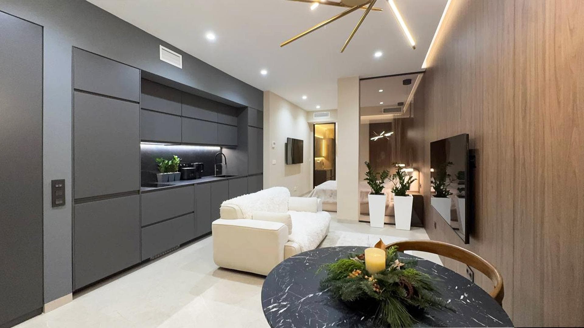 Stylish 1-bedroom apartment of 45 m² in the heart of Torrevieja, just 250 meters from Los Locos Beach. The apartment offers a bright living area with panoramic floor-to-ceiling windows, a fully equipped modern kitchen, and a comfortable bedroom with built-in wardrobe and elegant finishes. The bathroom features a rainfall shower, stone washbasin, and underfloor heating. Climate control, LED lighting, and a private terrace complete this sophisticated Mediterranean retreat—ideal as a holiday home or a permanent residence under the Spanish sun.