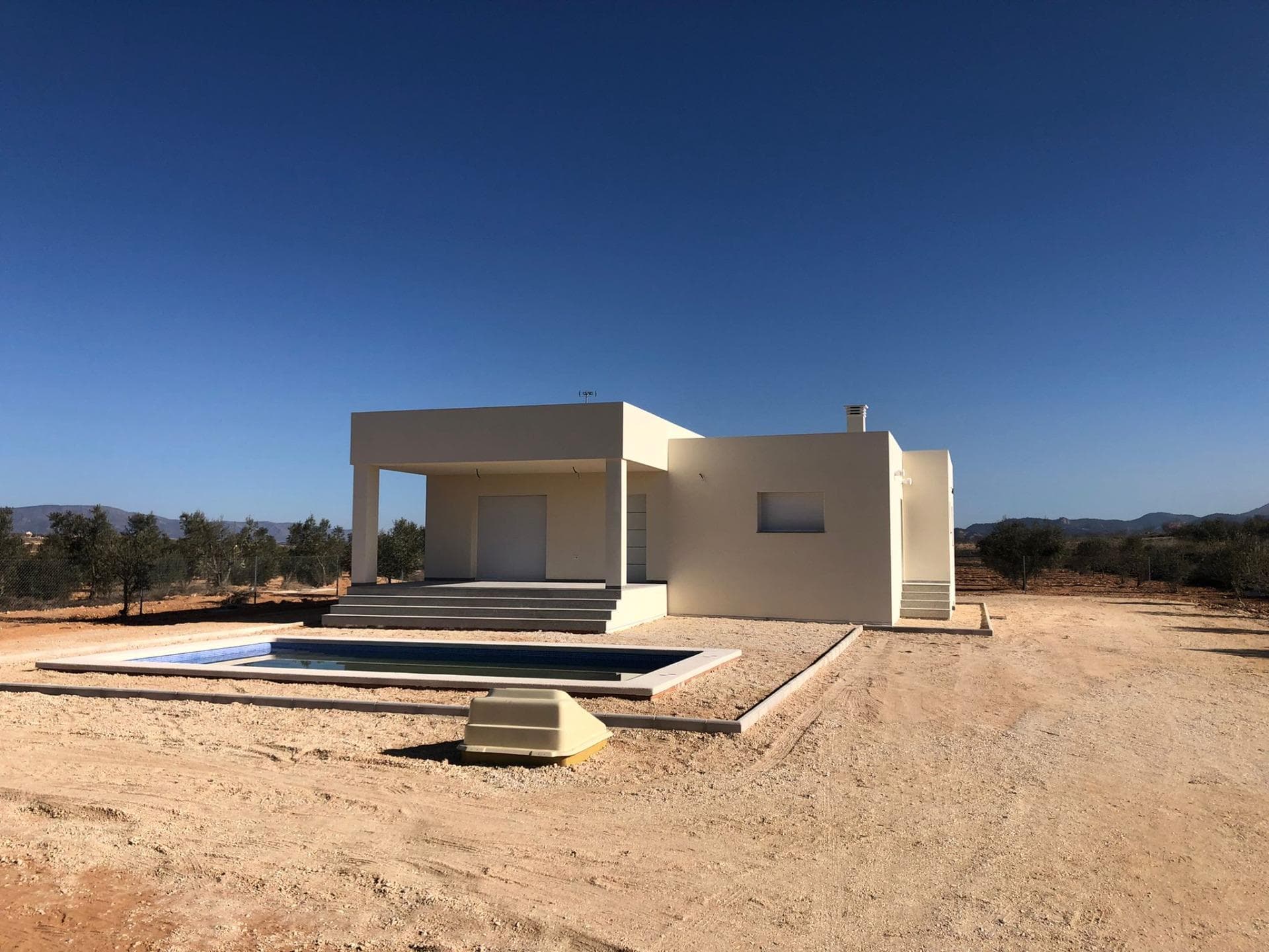 Villa in Pinoso area 03650, with a surface of ​​150.00 m² and a plot size of ​​10,000m². It is located only at 50 meters from the beach and features three double bedrooms, two bathrooms and it's brand new.Extras: water supply; garden; bright rooms; electricity connection ; patio & pergola areas ; private pool , pre-installation for air conditioning system available on site also there are high ceilings which gives you great room space to enjoy . Other attractions include terrace that offers stunning views over mountainous landscape , surrounded by trees thus provides rural atmosphere as well fencing makes your privacy assured.