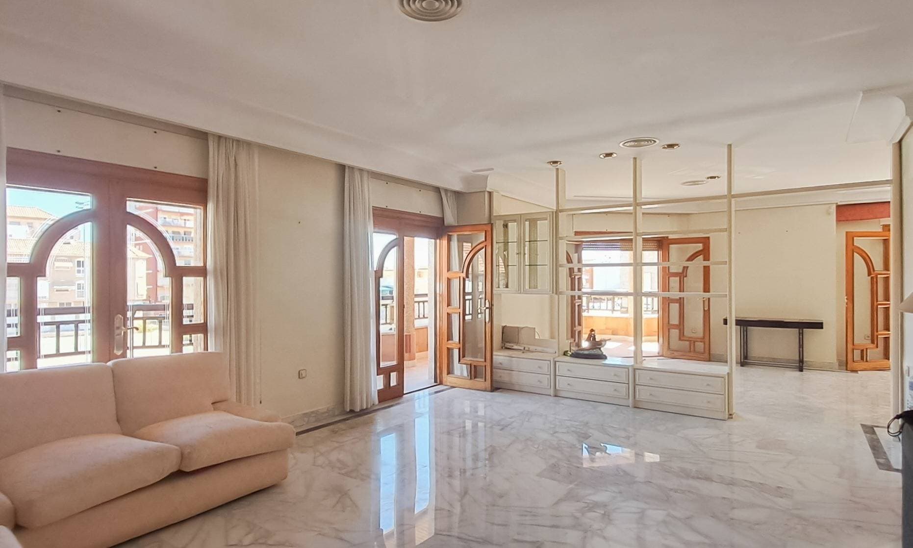 Discover this spectacular full first-floor apartment of 280 mÂ², located on the prestigious Avenida Emilio Castelar in San Pedro del Pinatar. This special property offers something very rare in today’s market: a large, elegant home with complete privacy and generous outdoor space, all in the heart of a town that retains its Spanish soul. Whether you're looking for a full-time residence or a spacious holiday home, this duplex penthouse offers unmatched potential in an unbeatable location. The property is rich in architectural character, featuring beautifully finished wooden window frames and elegant wooden glass doors throughout, bringing light, warmth, craftsmanship, and a touch of traditional charm to the home’s refined interior. This home stands out for its spaciousness, brightness, and elegance, featuring 6 bedrooms, 4 bathrooms, and unique outdoor spaces: Wrap-around balcony surrounding the entire floor Private interior patio Exclusive rooftop solarium The intricate ceiling, moldings, and door details are truly breathtakingâ€”something that photos simply cannot capture and can only be appreciated in person. Additionally, the impeccably maintained marble floors add a timeless sense of sophistication and quality that's hard to find in modern constructions. Located in one of the most sought-after areas of San Pedro del Pinatar, the property is just minutes from the Mar Menor, the Salinas Nature Reserve, and its charming promenade. Surrounded by restaurants, shops, and all essential services, this home offers both comfort and convenience in an unbeatable setting. A property with character, elegance, and exceptional value, perfect for those seeking space, exclusivity, and a superior quality of life. Book your private viewing today and experience its true charm firsthand!