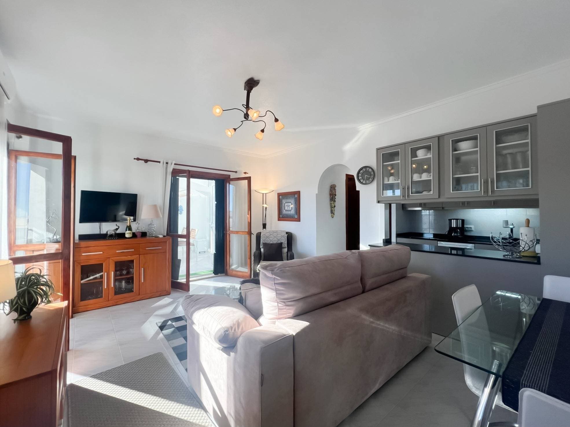 Discover this charming top-floor bungalow, offering the perfect blend of comfort, light, and outdoor living. This beautifully presented home features two spacious bedrooms and a modern bathroom, complemented by a bright and airy living area filled with natural light. The open-plan kitchen, complete with a stylish island and ample storage, seamlessly connects to the living space—ideal for both relaxing and entertaining. Step out onto the private balcony, where you can enjoy peaceful views over the community swimming pool. The property also boasts a glazed terrace with a full dining area, allowing you to make the most of indoor-outdoor living all year round. From here, access your private rooftop solarium—an ideal space for sunbathing, unwinding, or hosting guests. This rooftop also includes a convenient, custom-built storage room, perfect for keeping outdoor furniture and summer essentials neatly tucked away. Located within a well-maintained community just 750 meters from the beach, and close to all amenities in the sought-after Aguas Nuevas area, this property offers both convenience and lifestyle. With all complete new appliances, airconditioning and heating and furnoture included, this home is ready to move in. Whether you're looking for a permanent residence, a holiday retreat, or a smart investment, this bungalow is a fantastic opportunity not to be missed.