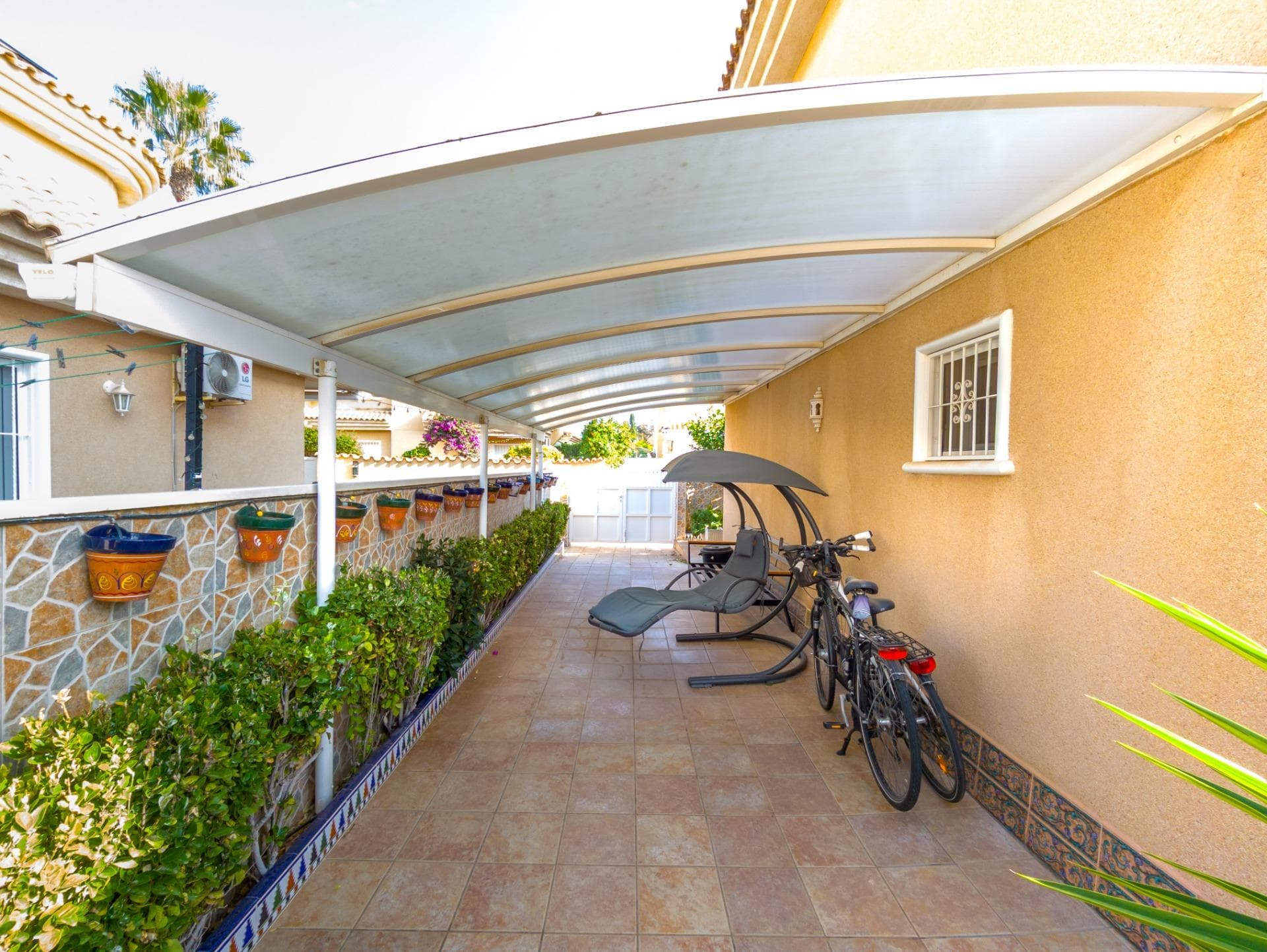 We present a fully renovated, two-storey detached villa with a private garden and on-plot parking, located in Orihuela Costa—one of the most sought-after areas on the Costa Blanca. Situated in a highly desirable residential area, this property allows you to enjoy the Mediterranean climate in complete tranquillity, surrounded by a healthy and active lifestyle. The home is part of an exclusive residential complex featuring a community swimming pool and designated parking spaces. This dreamy residential zone offers the perfect blend of Mediterranean charm, nature, and serenity—making it an ideal place to live year-round. It’s just 5 minutes by car to the beach and only 3 minutes to La Zenia Boulevard, the largest open-air shopping centre on the Costa Blanca. Upon entering, you’re greeted by a beautifully landscaped, well-maintained private garden with a relaxing seating area—and ample on-plot parking for several vehicles. The layout is highly functional: this is a fully detached, fenced villa with two floors and a private garden. Inside, you’ll find a spacious, recently renovated living room, plus a separate, fully equipped kitchen with integrated utility/laundry area—ideal for efficient household organisation. The property features 3 furnished bedrooms and 2 modern bathrooms—both fully renovated and fitted with underfloor heating. Additionally, there’s a large, bright 20 m² terrace with open, unobstructed views. Orihuela Costa is a thriving coastal town on the Costa Blanca—popular both as a holiday destination and for long-term living. The area continues to grow year after year, with new schools, sports centres, infrastructure projects, and residential developments underway. Thanks to its warm, sunny climate, it also offers year-round beach tourism. This is a peaceful, secure location—perfect for permanent residence or as a high-potential investment. The price of the property does not include notary fees, registration costs, or applicable taxes, which vary depending on the property price and the current regulations in the Comunidad Valenciana.