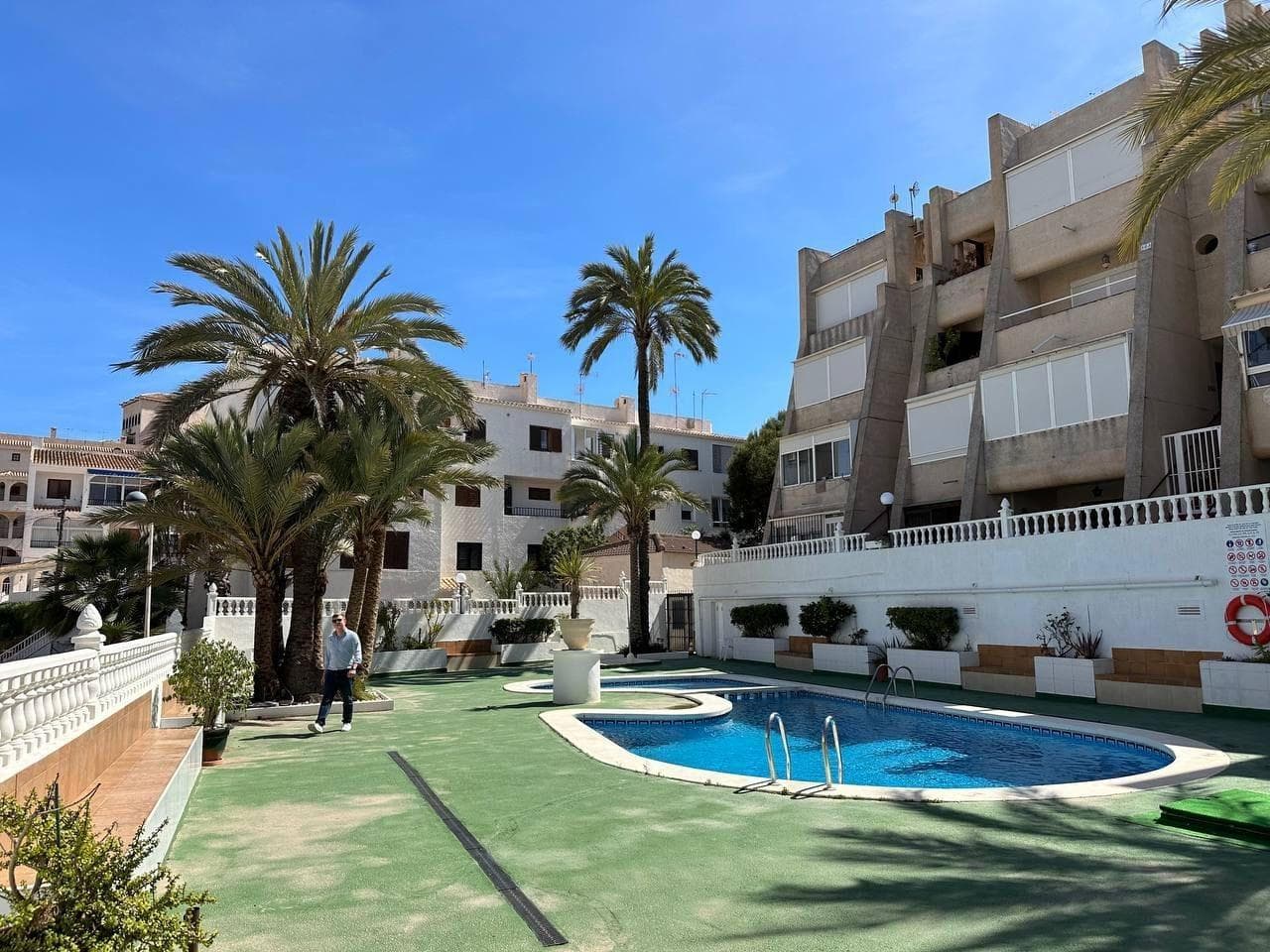 Duplex with Designer Renovation and Solarium in Cabo Cervera – 500 m from the Sea Luxury two-level apartment with high-end designer finishes and a private solarium offering panoramic sea views. Fully furnished and equipped, located just 500 m from La Mata beach in the prestigious Cabo Cervera area. Ideal for personal use or as a rental investment — tourist license included. Key features: – 80 m² – 2 bedrooms – 2 bathrooms – Solarium with BBQ and pergola – Open-plan kitchen with island – Walk-in wardrobe – Underfloor heating throughout – Home cinema system – Shared pool and green areas – Air conditioning Sold fully furnished and equipped — just like in the photos. Location & surroundings: – 500 m to the sea – 10-minute walk to La Mata beach – Prime area with all amenities – 40.7 km to Alicante Airport Financial info: – Price: €210,000 – 50% of the price can be paid in cash – Tourist license – Rental income:  • Long-term: €1300–1500/month  • Short-term: 8% annual yield (€18,000/year net)  Contact us for more details or to arrange a viewing — we speak your language!
