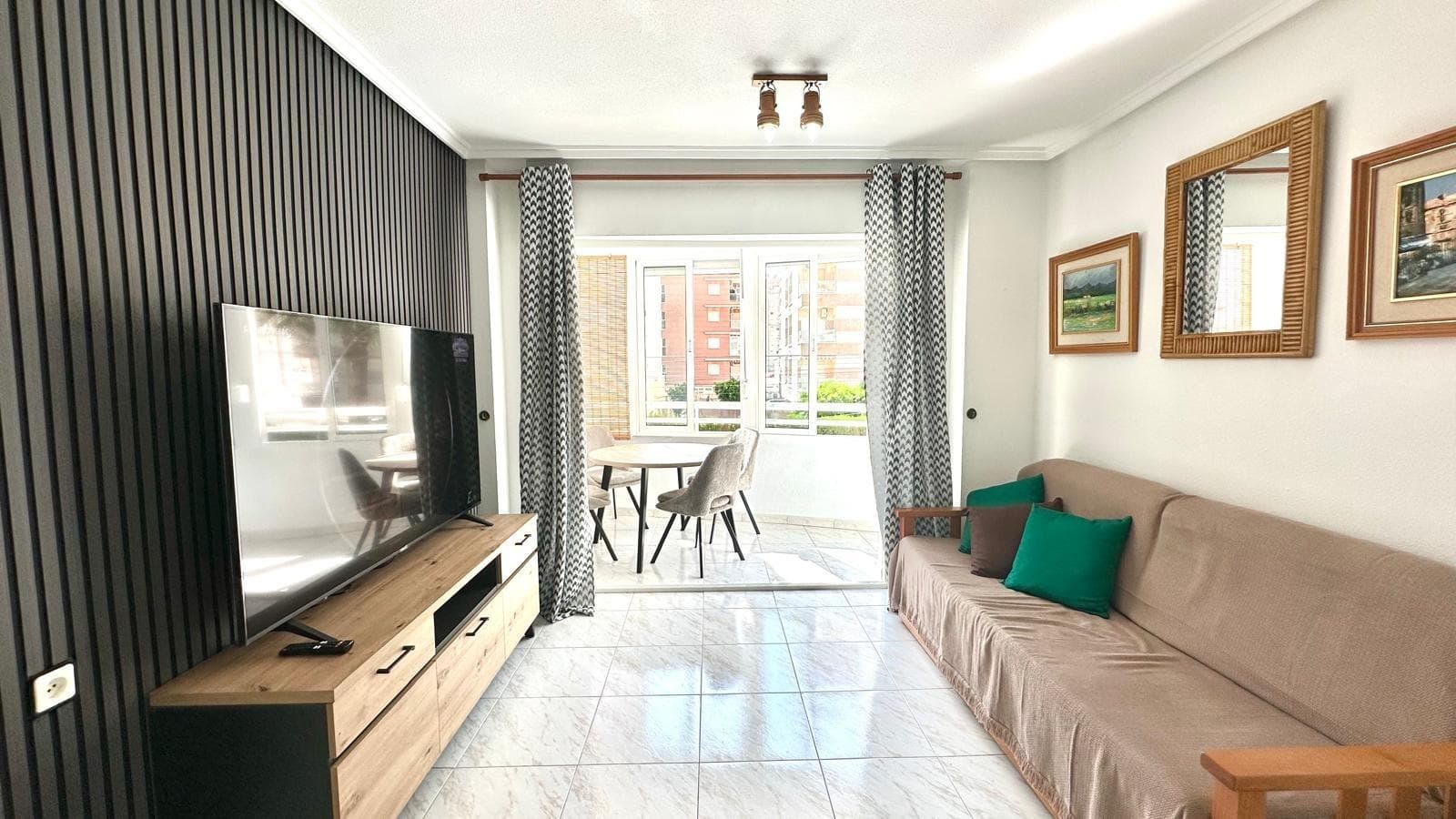 Beautiful Renovated First Floor Apartment with Modern Design – Nueva Torrevieja, Communal Pool, and Glazed Terrace We present this fantastic first-floor apartment located in the coveted area of ​​Nueva Torrevieja. It has recently been completely renovated, boasting an elegant and contemporary modern design, ready to move in and enjoy. The property stands out for its excellent layout and quality details. It has three bedrooms, ideal for families, entertaining guests, or as an office or work area. The bathroom, equipped with a bathtub, combines comfort and functionality. The living area offers an open and welcoming atmosphere, where the living-dining room and kitchen are perfectly integrated into a single open space, providing greater spaciousness and light. The modern and contemporary kitchen connects directly to the glazed terrace, a versatile and protected space, ideal for year-round enjoyment. From the terrace, you can enjoy pleasant views of the communal pool, providing an extra sense of tranquility and well-being. The west-facing home guarantees sun and natural light during the afternoons, making it especially inviting. Furthermore, the development offers its residents a communal pool, ideal for cooling off in the summer months, relaxing, and enjoying a pleasant and safe environment. Located in the quiet area of ​​Nueva Torrevieja, the property is close to all amenities: supermarkets, medical centers, pharmacies, restaurants, and public transportation, and just a few minutes' drive from the beaches and downtown Torrevieja. An ideal home both as a permanent residence and as a holiday investment, with everything you need: modern design, spacious spaces, a communal pool, and a glassed-in terrace.