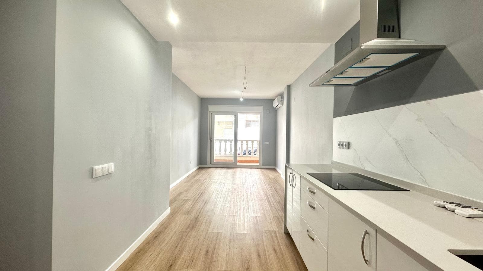 Fully renovated ground floor apartment just 100 metres from the sea in Playa de La Mata We present this magnificent, completely renovated ground floor apartment, located in the prestigious area of Playa de La Mata (Torrevieja), just 100 metres from the sea. A property that combines modern design, functionality and an unbeatable location, perfect for those looking to enjoy the Mediterranean lifestyle with all the amenities at their fingertips. The property, refurbished with high-quality materials and attention to every detail, has a practical and comfortable layout. It has two bedrooms, both spacious and bright, and two full bathrooms, one of which is en-suite in the master bedroom, offering greater privacy and comfort. The heart of the house is a cosy living-dining room with a fully equipped open-plan kitchen, a modern and open space that promotes spaciousness and communication between rooms. The contemporary-style kitchen has modern fittings, integrated appliances and a functional design for everyday use. The living room opens onto an outdoor terrace, ideal for enjoying al fresco dining or simply relaxing in the sea breeze. The property also has an interior courtyard, which provides additional light, natural ventilation and extra space that is very useful as a laundry area or relaxation corner. The property faces north, which makes it particularly cool during the summer months, maintaining a pleasant temperature inside. Its design and recent renovation make it a ready-to-move-in property, with no need for additional improvements. Its location is truly privileged: just 100 metres from La Mata beach, one of the most renowned in Torrevieja, surrounded by all amenities - restaurants, supermarkets, pharmacies, public transport and leisure areas - ensuring comfort and quality of life all year round. In short, this renovated ground floor flat represents an excellent opportunity for those looking for a modern, functional home close to the sea. Whether as a primary residence, second home or tourist investment, it offers everything you need to enjoy the authentic Mediterranean charm in one of the most emblematic areas of the Alicante coast.