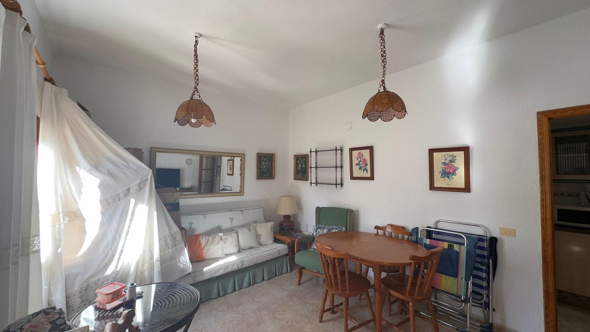 This charming two-bedroom, one-bathroom townhouse, located in the tranquil and sought-after Calas Blancas area, offers a relaxed, Mediterranean lifestyle, perfect for those who want to enjoy the comfort of a home with its own outdoor space and a well-maintained, pleasant residential environment. From the moment you step inside, it feels like home, a place designed to unwind, enjoy the pleasant climate, and share special moments both indoors and in the private garden. It's a property that beautifully combines the idea of ​​a personal retreat with the opportunity to live outdoors, something increasingly valued. Upon arrival, the garden becomes the true focal point and the home's defining feature. This outdoor space gives the house its own unique character, offering a place to enjoy the mild climate practically year-round. It's easy to imagine leisurely breakfasts in the sun, afternoons spent reading under a parasol, or gatherings with family and friends around a table as the breeze gently blows. The garden allows for creative decorating and adapting to any lifestyle: you can create a chill-out zone with sofas and cushions, a small outdoor dining area, a corner with a hammock, or even a green space with plants, flowers, and a tree to provide shade and coolness. For those with pets, it's also a perfect place for them to enjoy themselves freely and safely. Being a semi-detached house, it offers the sense of independence and privacy that many seek, without sacrificing the neighborhood and the security of a well-established community. Living in a house with direct street access and your own garden is not the same as living in an apartment; here, coming and going becomes a simple and comfortable experience, without elevators or communal hallways. This independence makes daily life more practical, especially for families, couples, or individuals who value being able to enjoy their home without so many limitations. The house invites you to live in a relaxed way, to move freely between the indoors and outdoors, and to make the most of every corner. Inside, the layout has been designed for comfortable and functional daily living. The separate kitchen is one of the house's greatest strengths, providing a dedicated space for cooking, storing, and organizing everything needed, without encroaching on the living room or relaxation areas. This separation brings order and cleanliness to the entire space, and also makes the home feel larger, as each area is clearly defined. In the kitchen, you can calmly prepare recipes, enjoy creating special dishes, or simply efficiently organize your daily routine, keeping the rest of the house free from cooking noise and smells. The living room becomes the heart of the home, the place where most of your time is spent. It's a space that invites calm, relaxation, and togetherness. Here, you can create a welcoming atmosphere with a comfortable sofa, a coffee table, a television area, and some accent furniture to personalize the decor with photos, books, and personal touches. Being visually or physically connected to the garden, the living room gains natural light and a sense of spaciousness, creating a perfect space for relaxing after work or enjoying long afternoons with friends and family. The transition between indoors and outdoors can be fully utilized, allowing the living room to become an extension of the garden and vice versa. The fact that the house is being sold furnished adds a significant advantage to all of the above. The buyer doesn't have to worry about complicated moves, long waits for furniture to be furnished, or the process of selecting furniture; the home is ready to be enjoyed from day one. Simply bring your personal belongings and begin a new chapter.