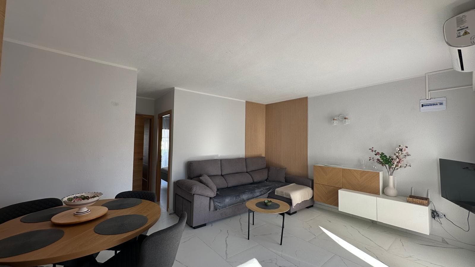 Living near the sea is an experience that transforms everyday life. Proximity to the beach provides a constant sense of calm, freedom, and well-being that is hard to find in other environments. This renovated rooftop bungalow, located just steps from the beach, offers precisely that opportunity: to enjoy the essence of the Mediterranean in a renovated, bright, and charming home. The city of Torrevieja has established itself as one of the most popular destinations on the Costa Blanca. Its combination of a privileged climate, welcoming atmosphere, and relaxed lifestyle makes it an ideal place to live year-round or enjoy longer stays by the sea. Here, the sun shines for much of the year, and the pace of life encourages you to savor every moment. This rooftop bungalow exudes a special feeling from the very first moment. The renovation has given it a modern and updated look, adapted to contemporary tastes and needs. The home has been transformed to offer a fresher, more modern, and pleasant atmosphere, where every space invites relaxation and togetherness. One of the great attractions of this type of property is its elevated position. A high-rise bungalow offers greater privacy and a different perspective of the surroundings. The sense of independence it provides creates a more tranquil and relaxed atmosphere, ideal for those seeking a home where they can disconnect from the daily grind. The terrace becomes one of the most special spaces in the home. In Mediterranean areas like Torrevieja, having a private outdoor space is a true privilege. This open-air haven allows you to enjoy the mild climate for much of the year, creating the perfect place to start the day with a coffee in the sun or to end it with a peaceful dinner under the clear sky. Just 200 meters from the beach, the sea becomes an integral part of the lifestyle. Its proximity allows you to walk down in just a few minutes to enjoy a stroll along the sand, a refreshing swim, or simply to contemplate the horizon. Living so close to the sea means being able to spontaneously unwind and enjoy nature without having to travel long distances. Torrevieja is a city with its own unique character. Its streets combine Mediterranean essence with an international atmosphere that makes it unique. The presence of residents from different nationalities creates an open and diverse environment, where it's easy to feel integrated and enjoy new cultural experiences. The bungalow's complete renovation brings a contemporary feel that perfectly complements the coastal style of the area. This balance between renovation and tradition creates a pleasant ambiance, where modernity blends seamlessly with Mediterranean charm. The result is a welcoming home, ready to begin a new chapter without the need for further changes. Living near the beach also means a more active and healthy lifestyle. Strolling along the promenade, playing outdoor sports, or simply breathing in the sea air become regular activities. The proximity to the water provides a constant feeling of freshness and well-being that positively influences mood. The bungalow adapts perfectly to different lifestyles. It can become the ideal home for a couple seeking tranquility by the sea, a comfortable home for a small family, or an excellent investment in one of the most sought-after areas of the Costa Blanca. The city offers a wide variety of services and leisure options. Restaurants, cafes, markets, and shops create a vibrant environment where there's always something to do. At the same time, its proximity to the sea allows you to enjoy moments of calm and relaxation when you want to escape the hustle and bustle of the city.