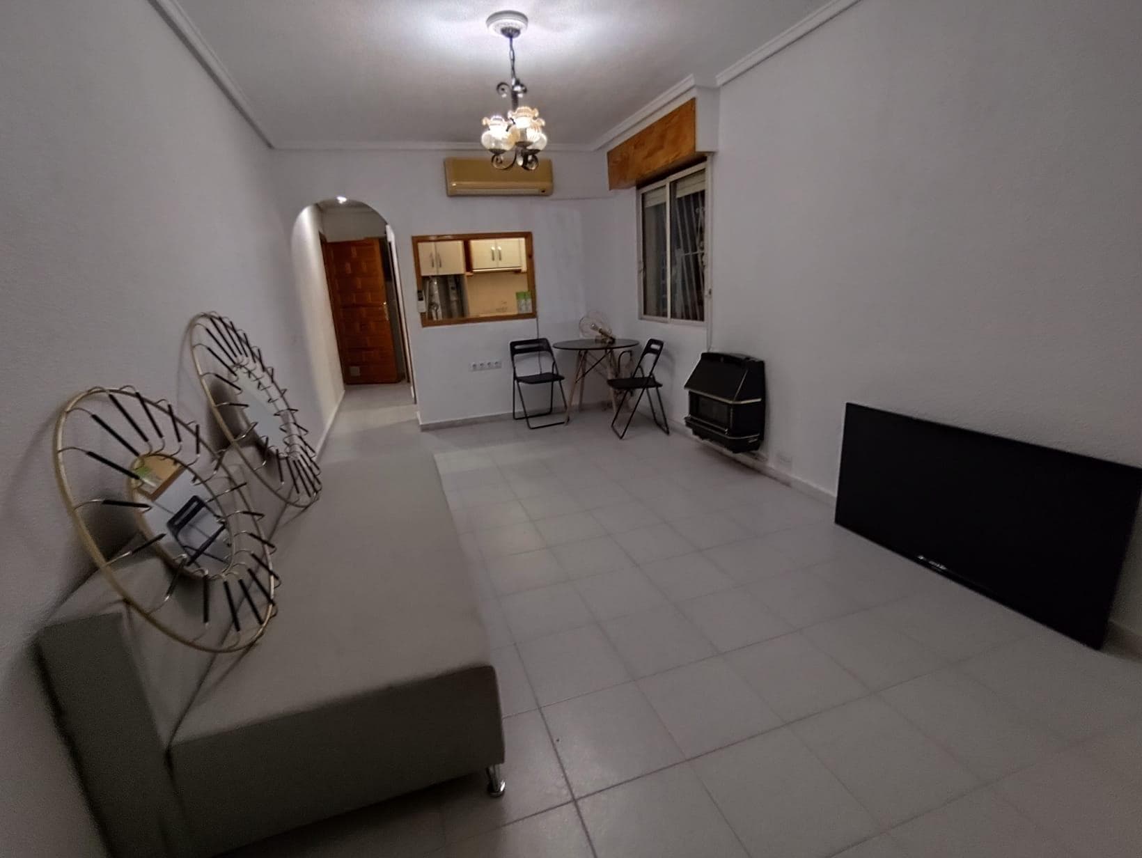 We present this charming 1-bedroom, 1-bathroom apartment located in the quiet and sought-after La Siesta area of ​​Torrevieja, a perfect location for those seeking a relaxed residential environment without sacrificing proximity to all amenities and just minutes from the city center and beaches. This property is ideal for year-round living, enjoying a second home on the Costa Blanca, or making a real estate investment, as it is sold fully furnished, allowing you to move in from day one without any additional expenses. The La Siesta area is known for its peaceful atmosphere, residential character, and excellent connections to the center of Torrevieja and the city's main access roads. It is a highly valued area for both local residents and international buyers seeking a more relaxed lifestyle near the sea. The apartment offers a comfortable and functional layout that makes the most of every space, creating a welcoming and pleasant environment. Upon entering the property, you'll find a bright living-dining room, a space designed for comfort and socializing. This room becomes the heart of the home, a perfect place to relax after a day of work, watch a movie, read, or share moments with friends and family. Thanks to its well-designed layout, the living room allows for different zones within the same space, such as a relaxation area with a sofa and television, as well as a dining area where you can enjoy meals together. The natural light streaming through the windows creates a feeling of spaciousness and well-being, fostering a warm and inviting atmosphere throughout the day. The practical and functional kitchen is equipped with everything necessary for daily use. It features furniture and appliances that allow for comfortable cooking, as well as ample storage space to keep everything organized. Its efficient design facilitates movement within the space and allows you to make intelligent use of every corner, making cooking a simple and enjoyable task. The apartment also boasts a spacious and comfortable bedroom, designed to ensure rest and tranquility. This room has enough space for a double bed, wardrobes, and other auxiliary furniture, creating an intimate and relaxing environment. It's the perfect place to disconnect and recharge after a day enjoying the sun and sea on the Costa Blanca. The fully equipped bathroom, in good condition and functional, has everything you need for daily use. Its layout is designed for comfort and ease, making it a practical space within the home. One of the great advantages of this property is that it is sold fully furnished, which represents significant savings for the buyer. This allows you to move in immediately or start renting the property without needing to make any additional investments. For those looking for an investment property, this apartment represents an excellent opportunity, as one-bedroom apartments are in high demand for rentals, especially in quiet and well-connected areas like La Siesta. The La Siesta area offers an excellent quality of life. It is a peaceful residential neighborhood where you can enjoy a relaxed pace of life, surrounded by nature and with all the necessary amenities nearby. In the vicinity of the apartment you will find supermarkets, restaurants, cafes, pharmacies, medical centers, parks and public transport, allowing you to carry out all your daily activities with ease.