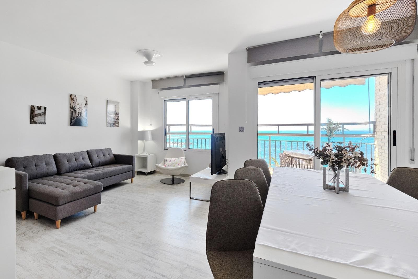 Discover this spectacular 3-bedroom, 2-bathroom apartment located on the beachfront of Playa del Cura in Torrevieja. This unique property combines a prime location, spaciousness, and authentic Mediterranean living. It's an exceptional opportunity for both those seeking a beachfront home and investors looking for a high-yield property in one of the most sought-after areas of the Costa Blanca. This apartment stands out for its unbeatable location, literally just steps from the beach. From the apartment, you can enjoy the sound of the sea, the sea breeze, and views that make every day a unique experience. The property is sold fully furnished, allowing you to move in immediately without any additional investment. Every room has been designed to offer comfort, functionality, and a welcoming atmosphere, ideal for both personal use and rental. Upon entering the apartment, you'll find a spacious and bright living-dining room, which becomes the heart of the home. This space stands out for its spaciousness and abundant natural light, creating a warm, elegant, and inviting atmosphere. From the living room, you can access a private terrace with sea views, one of the property's greatest assets. This outdoor space is perfect for enjoying the privileged setting of the home. Imagine having breakfast overlooking the Mediterranean, relaxing with a drink at sunset, or simply gazing at the sea from the comfort of your home. The terrace becomes a true luxury, a place to disconnect and enjoy the Costa Blanca climate year-round. The fully equipped kitchen offers a functional and comfortable space for everyday life. It features furniture and appliances that facilitate meal preparation, as well as a practical layout that makes the most of the space. The apartment has three spacious and bright bedrooms, making it an ideal home for families or those who need extra space. The master bedroom offers a tranquil and comfortable atmosphere, perfect for rest, while the other two bedrooms can be used as guest rooms, children's rooms, or even as an office. The two full bathrooms provide added convenience, especially in family homes or rental properties. Both are equipped with everything necessary for daily use and feature a functional layout. One of the great strengths of this property is its spaciousness, something uncommon in beachfront homes. Having three bedrooms and two bathrooms in this location is a highly sought-after feature in the real estate market. The location on Playa del Cura is undoubtedly one of the biggest draws of this property. It is one of Torrevieja's most iconic and popular beaches, known for its lively atmosphere, fine sand, and wide range of services. In the surrounding area, you'll find a wide variety of restaurants, cafes, bars, shops, and services, allowing you to enjoy a comfortable and dynamic lifestyle without needing a car. The seafront promenade, located right next door, is one of the city's most popular spots, ideal for strolling, playing sports, or enjoying local cuisine with sea views. Torrevieja is a city that perfectly blends tradition and modernity, offering an excellent quality of life thanks to its climate, international atmosphere, and wide range of leisure activities. With over 300 days of sunshine a year, it's a perfect destination for both living and investing. Furthermore, it boasts excellent transport links, being approximately 40 minutes from Alicante Airport, facilitating access for international buyers.
