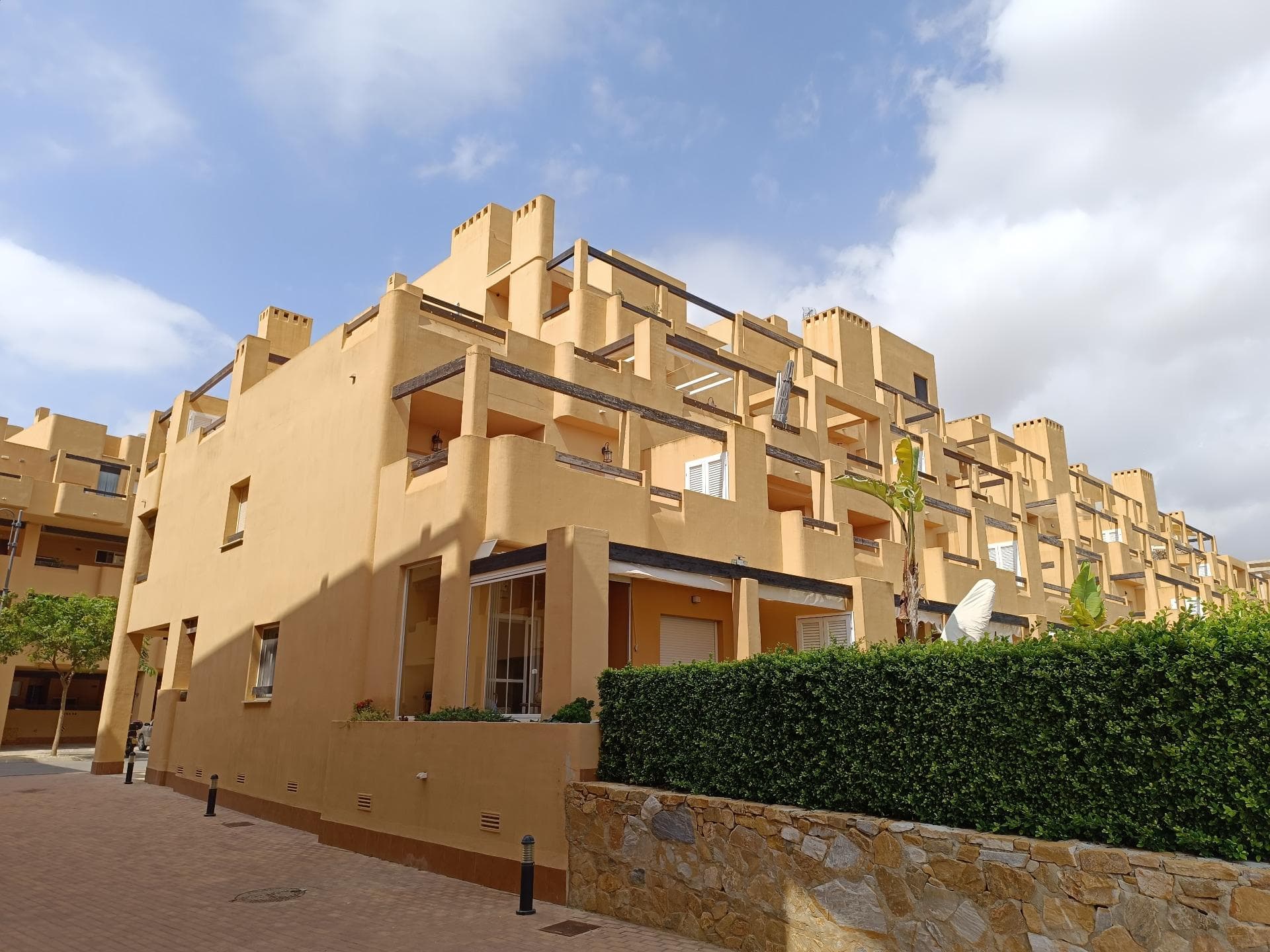 First floor, 2 Bed Corner apartment on ' La Isla ', a man-made Island on the Golf Resort of Las Terrazas De La Torre. This property has amazing views over the lake and the golf course, with 2 infinity pools very nearby. The kitchen is fully fitted with all white goods, and comes furnished throughout. There is also Full AC, recently installed, throughout the apartment. In between the 2 bedrooms there is a nice family bathroom. The terras is spacious and offers stunning views. The Island is surrounded by a Lake and a Golf Course, only a few minutes walk to the Resorts Clubhouse, Restaurant and Supermarket. There are 16 communual pools  More businesses will be opening in the commercial center, which makes it the perfect time to buy on this resort. This complex has a single entrance and its facilities are fully fenced, with 24 hour security for the safety of its residents. If you are a golf fan you will be able to play on a 18 hole golf course created by Jack Nicklaus, whose semi-desert design blends in with the natural landscape, thus demonstrating a high degree of efficiency of natural resources.  Offering fantastic value for money, phenomenal security and a superb location, Las Terrazas de la Torre is a wonderful resort that offers buyers the opportunity to find a beautiful home at an excellent price. It is just a short drive, 15 minutes, from the Mar Menor and Mediterranean coastlines, plus Murcia international airport and 20 minutes to Cartagena and Murcia.